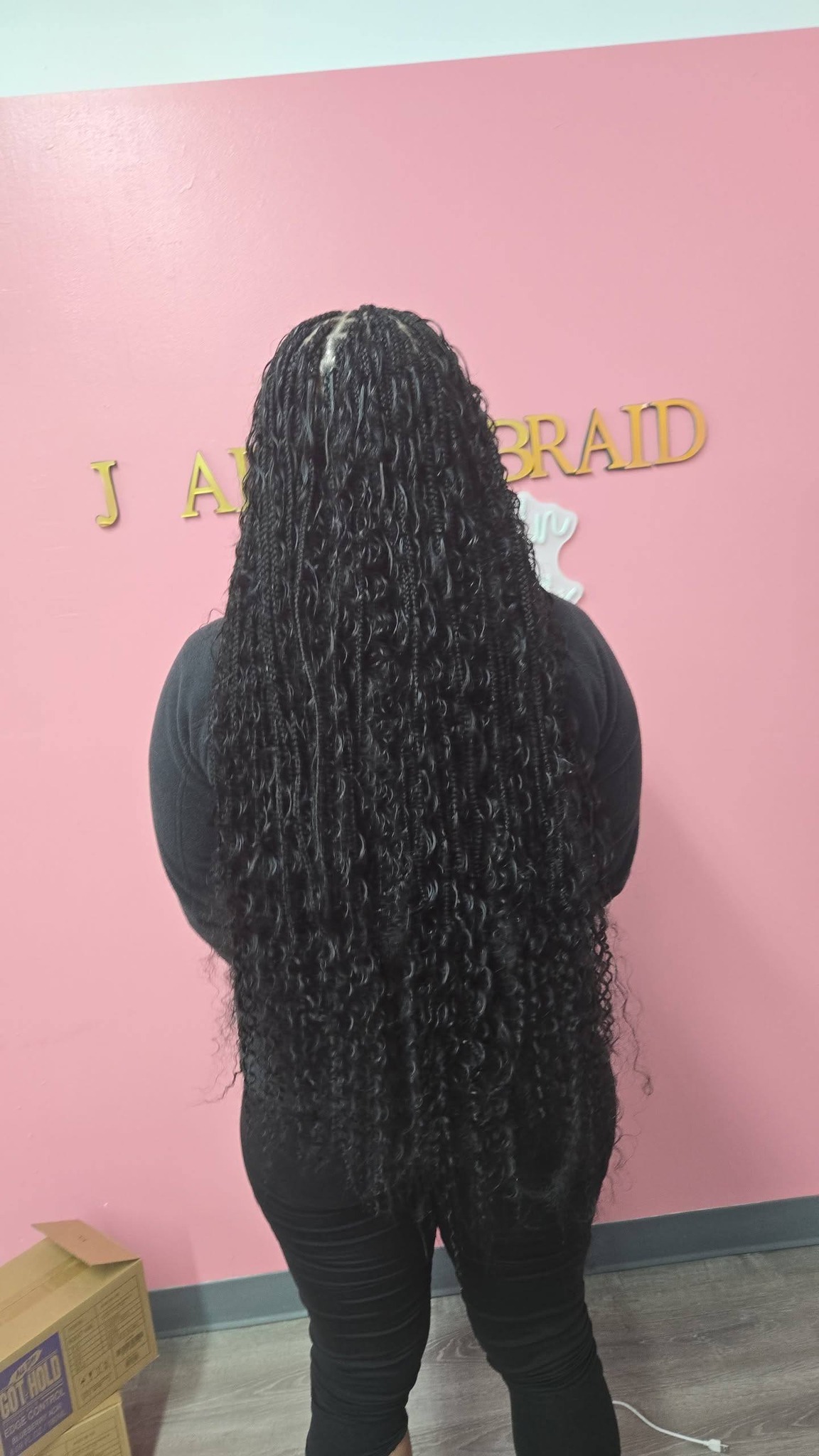 Long black knotless box braids by Mimi's braid studio