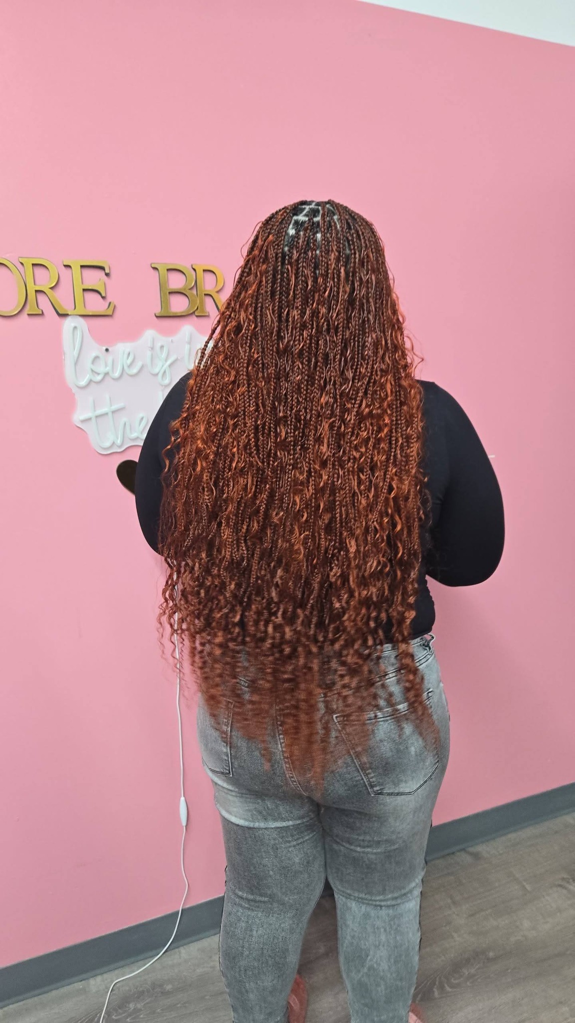 Copper brown boho curly braids on pink background
