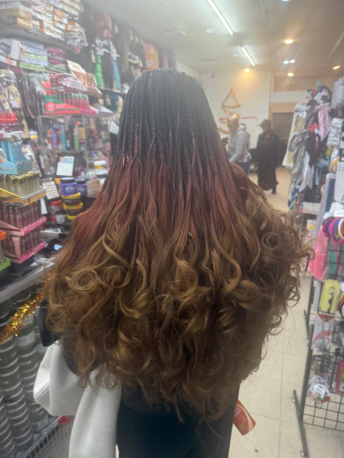 Ombre Senegalese twist braids in brown, red, and blonde