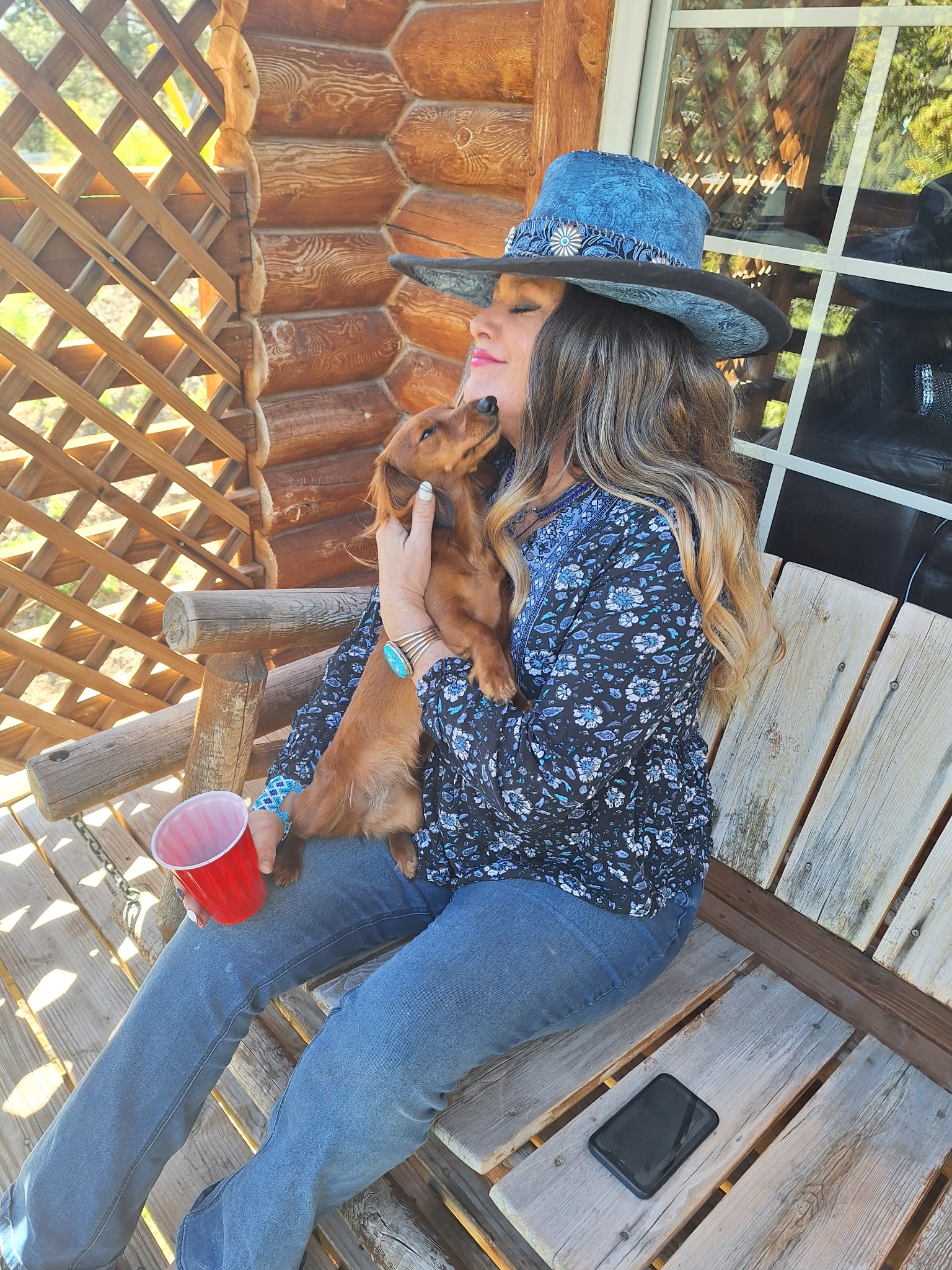 Cheri Payne holding her dachshund, Hunee