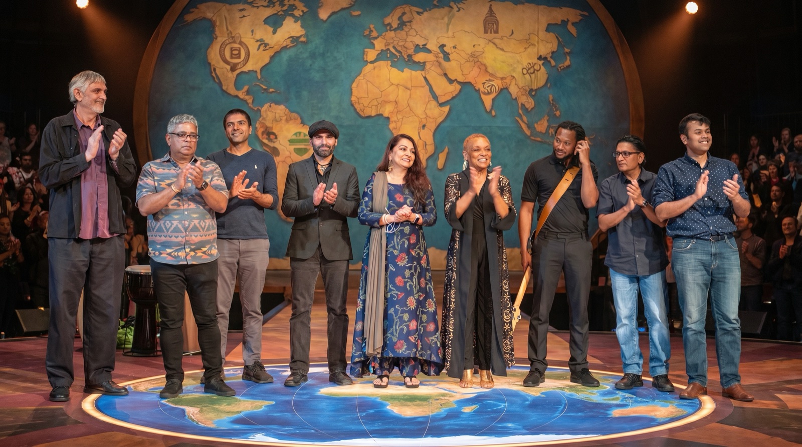 BridgeWell international artists on stage before a world map