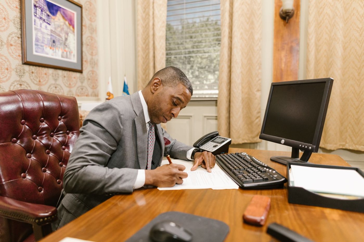 Attorney reviewing case documents at a desk