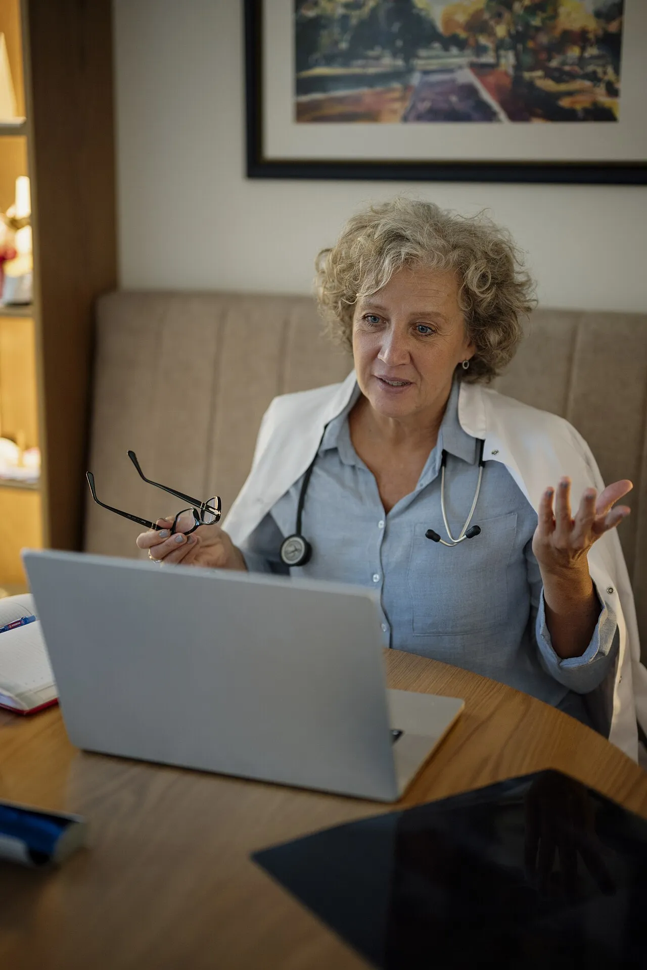 A doctor talks with a patient during a video consultation