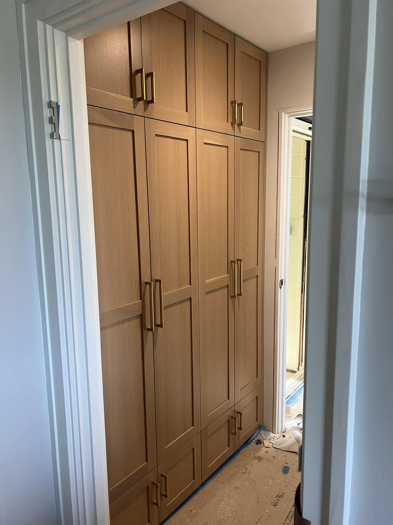 Floor-to-ceiling hallway cabinetry — after renovation