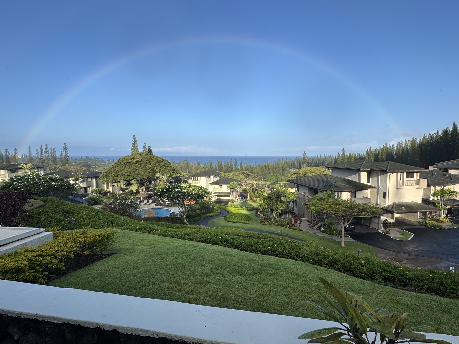 Kapalua Bay Villa — oceanfront view with full rainbow over the resort