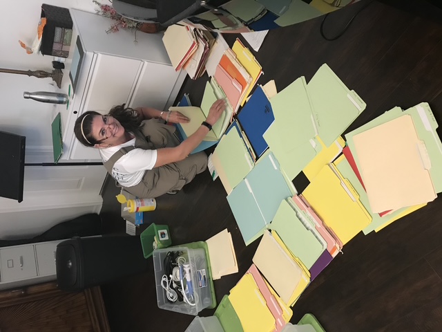 Household paperwork being sorted during a professional paper organizing session