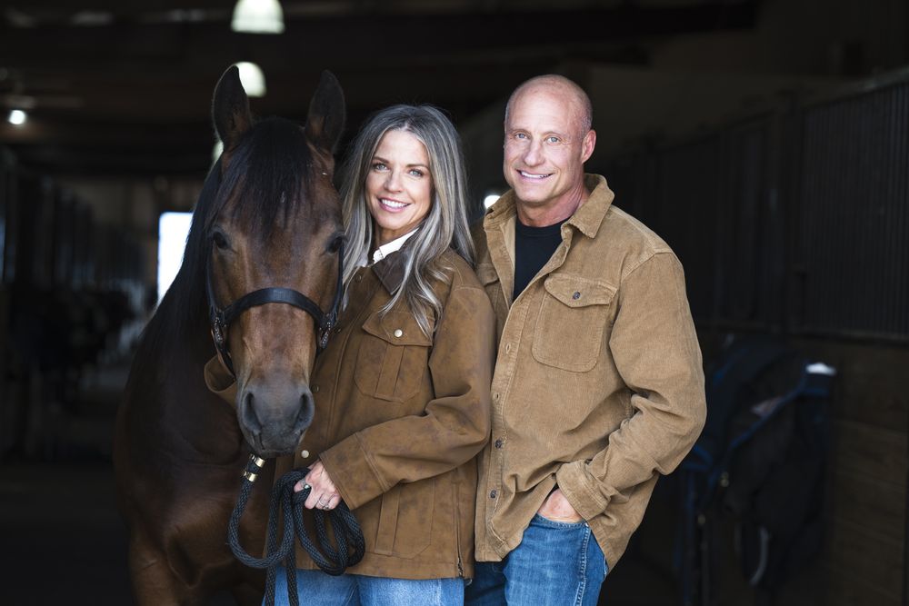 Christine and Brad Zanin standing together at the stable.