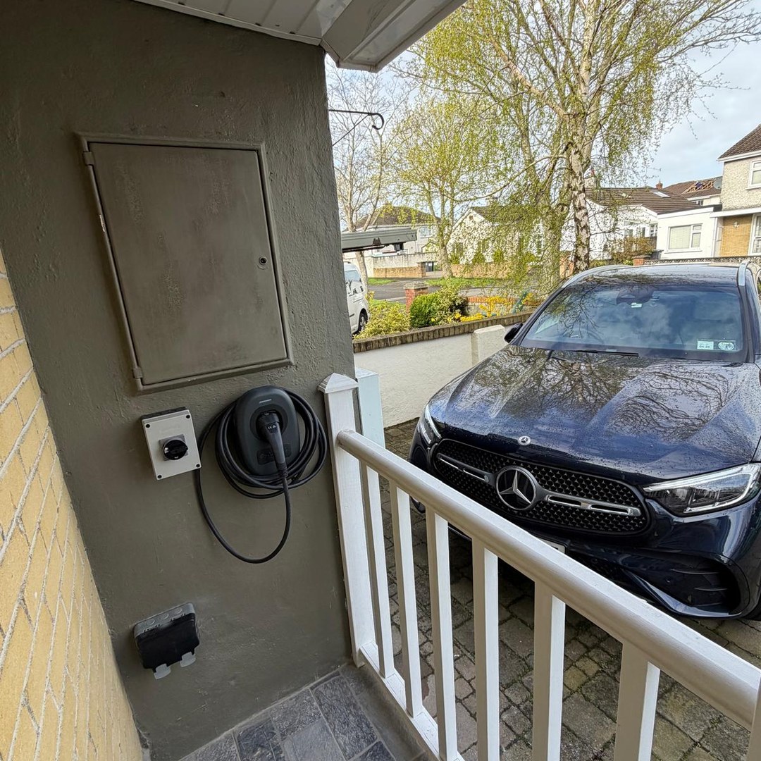 EV charging at a home driveway, installed by AD Electrical Group