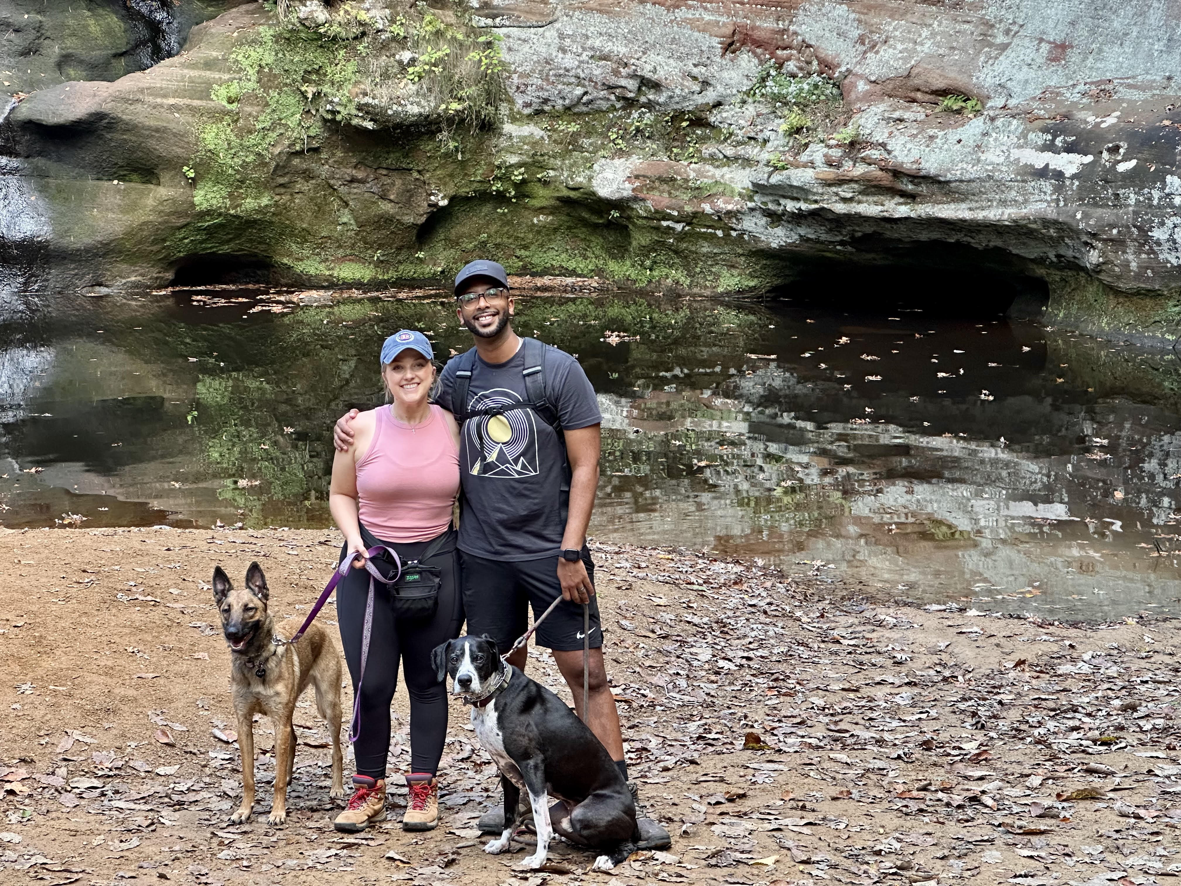 Ebisa and his wife with their two dogs