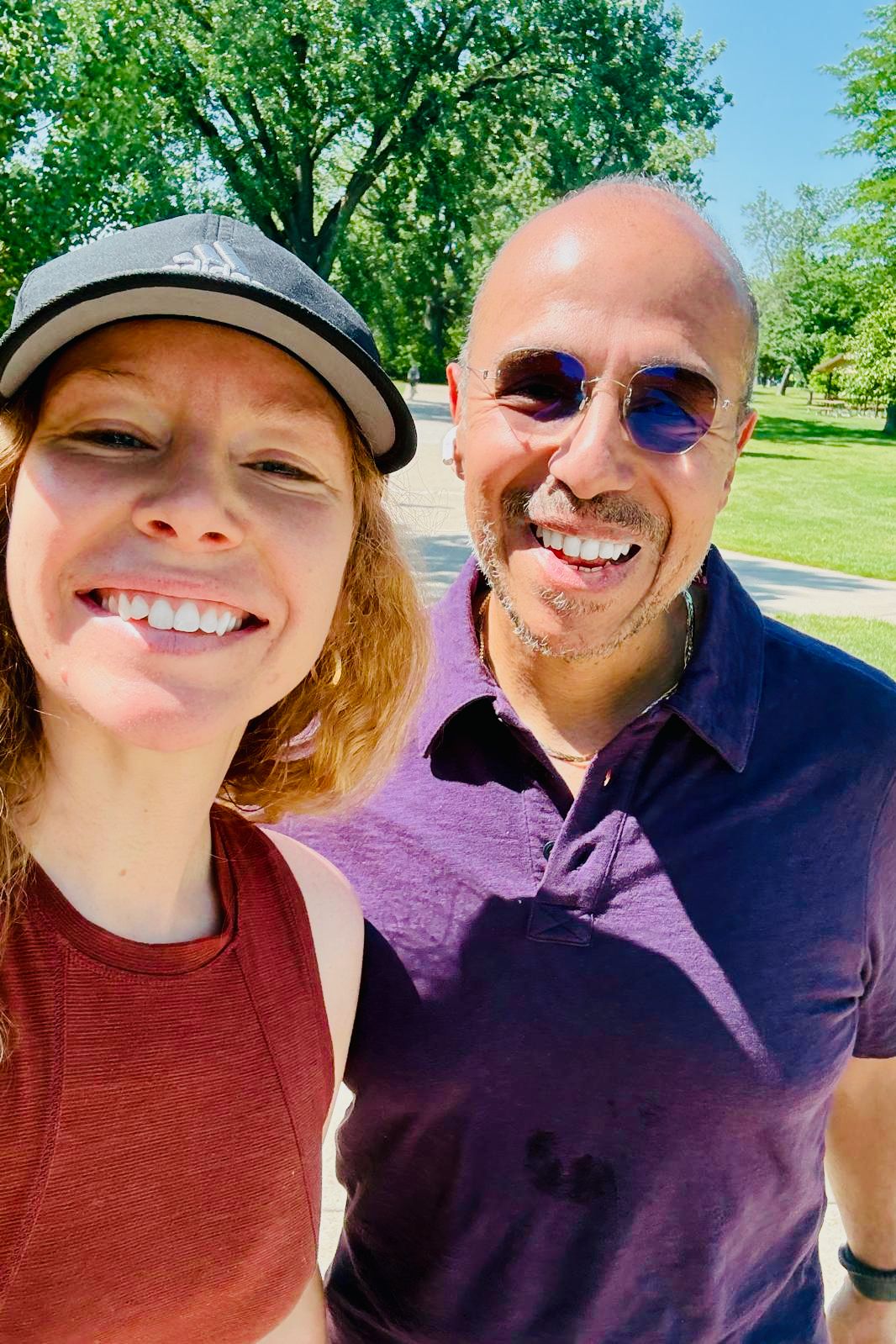 Megan Rose and Dr. Luis A. Hernández Ríos smiling together outdoors