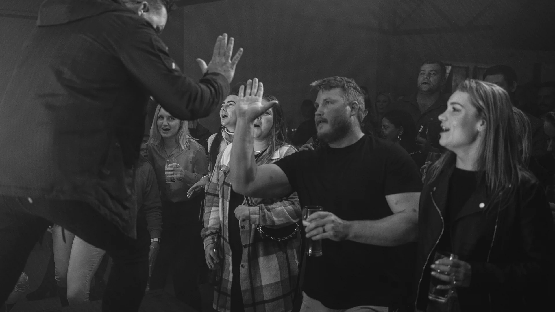 Crowd dancing with the performer during a live show at Breezy's