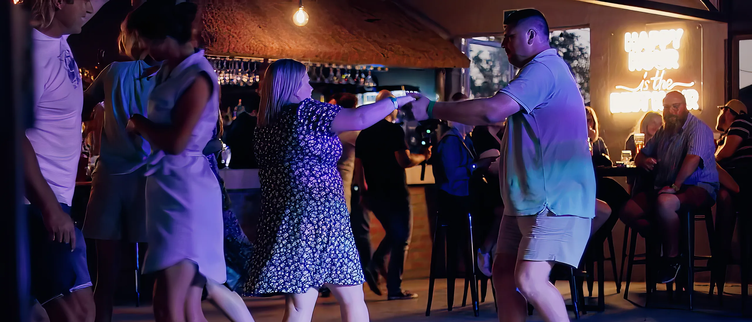 Guests dancing on the dance floor at Breezy's