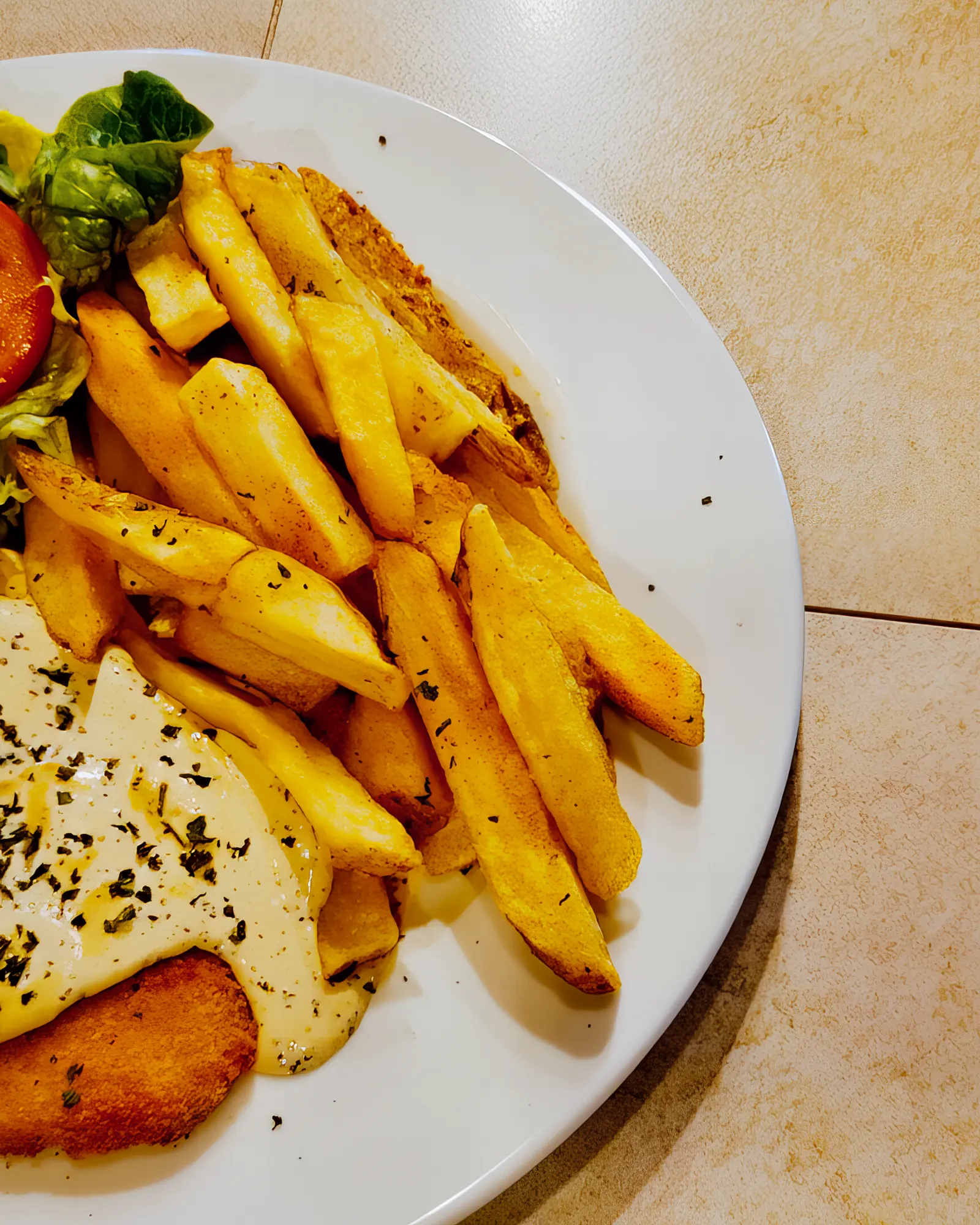 Chicken schnitzel with chips and salad at Breezy's