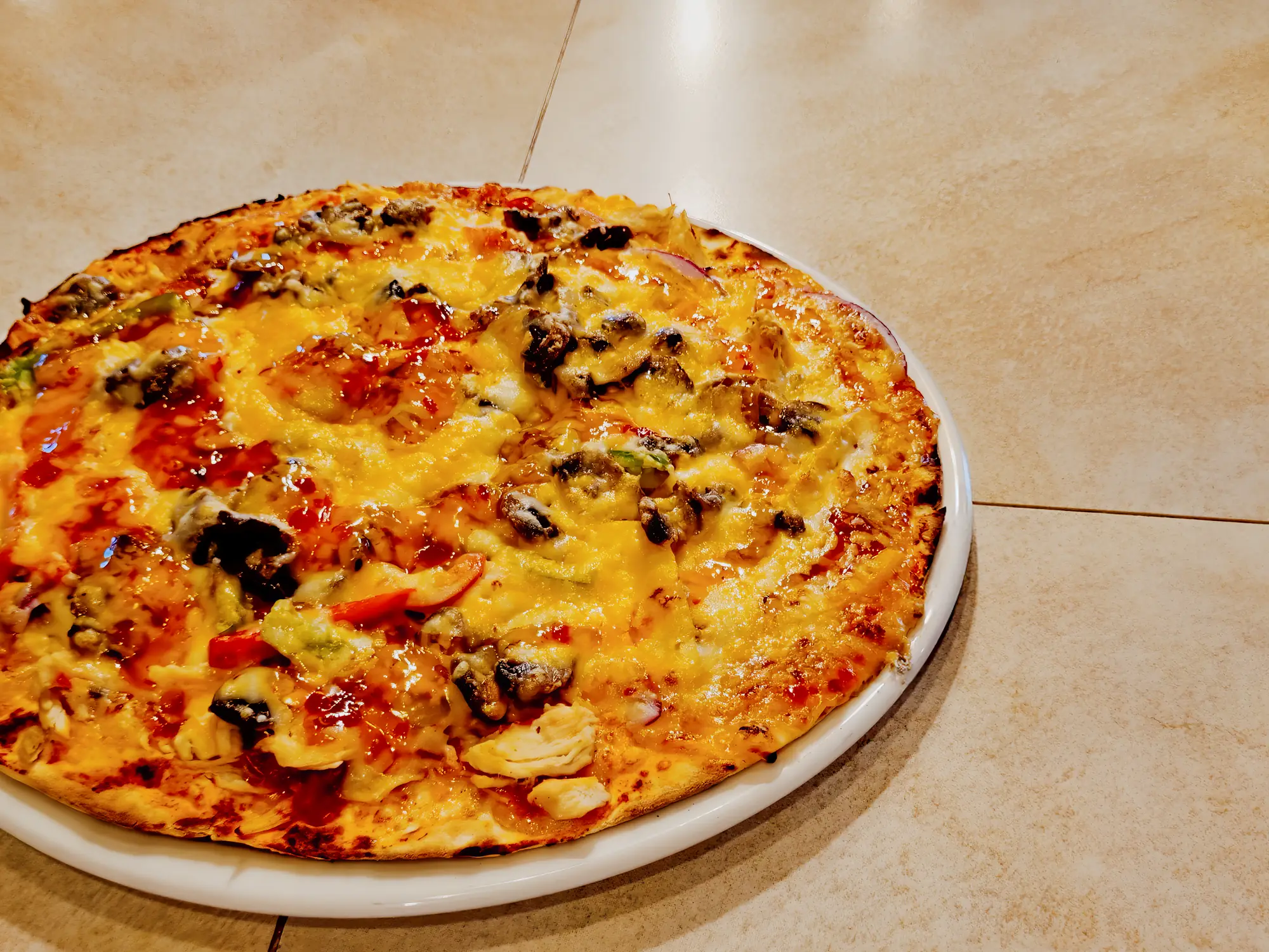 Pizza served whole at Breezy's