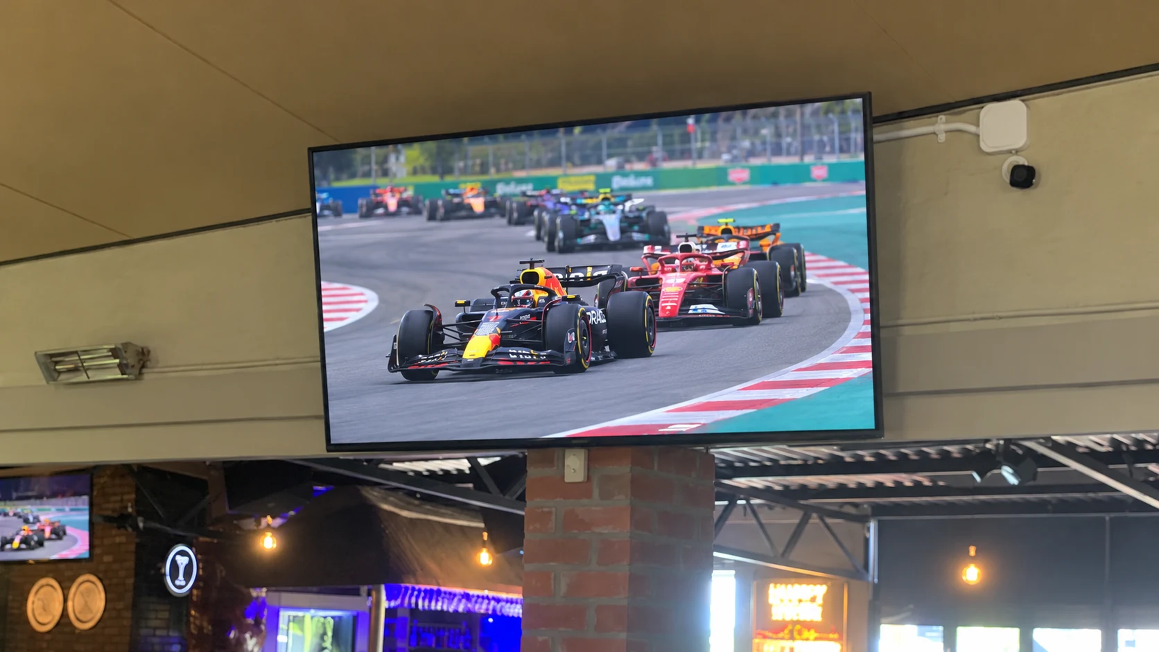Formula 1 race on a TV under the roof at Breezy's