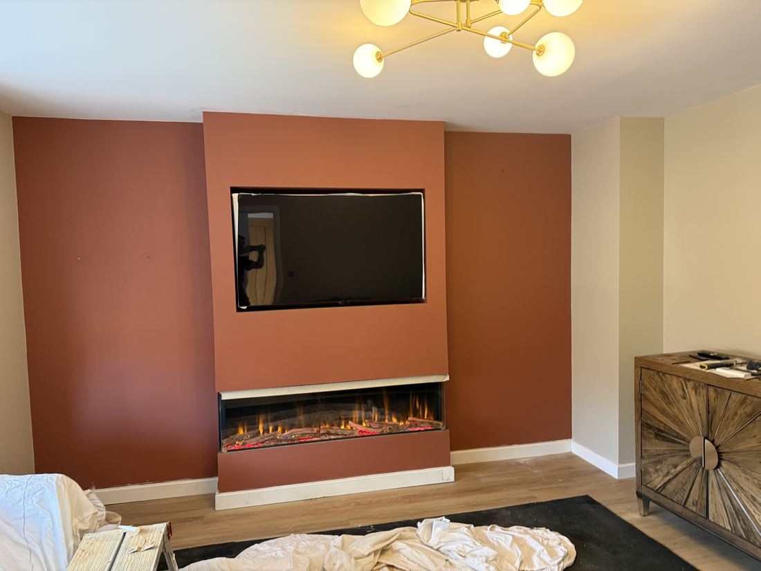 Media wall with an inset electric fire