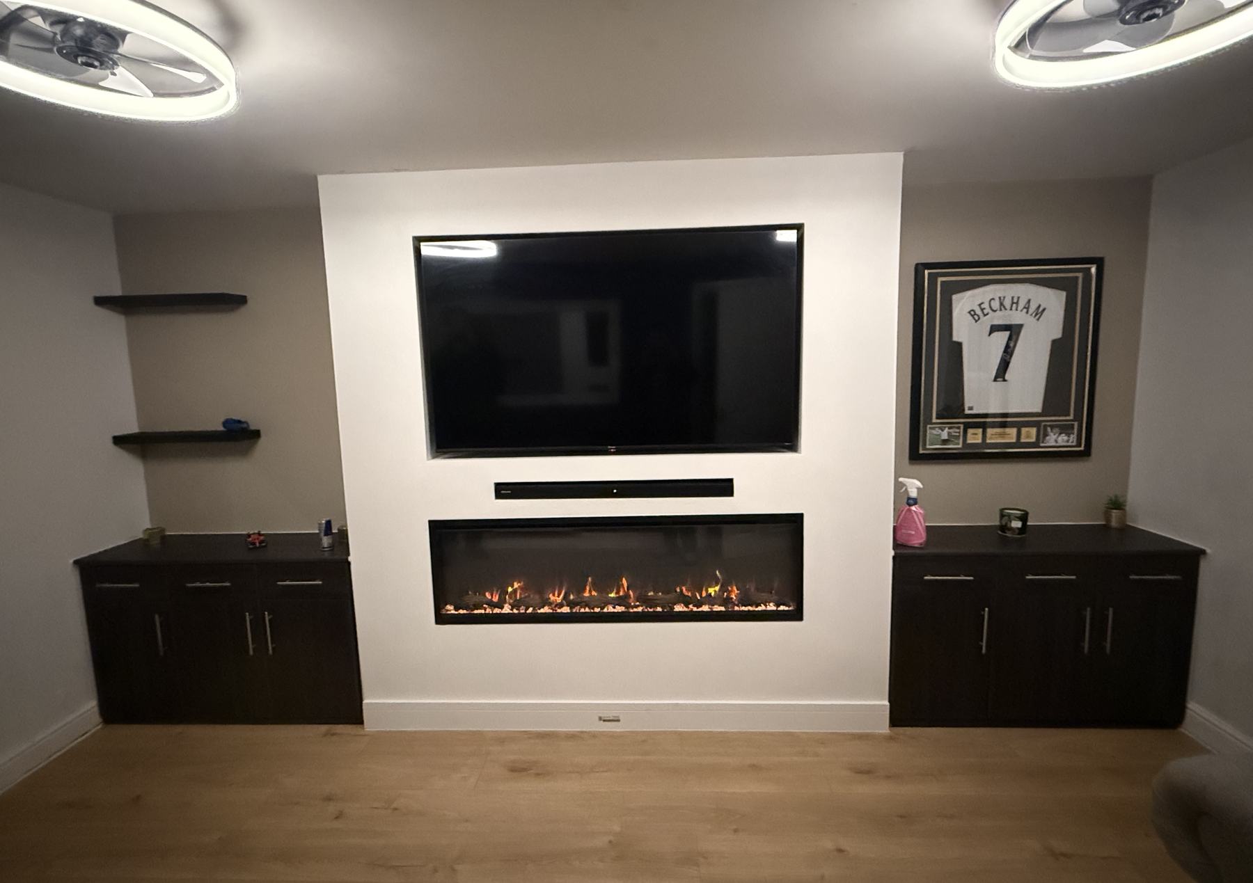White chimney breast media wall with an inset fire and soundbar recess