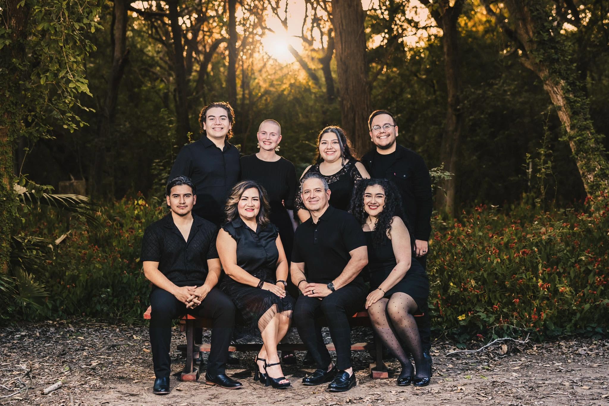 A family portrait outdoors at sunset