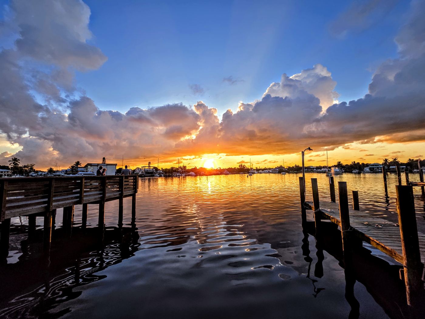 Sunrise over a still Florida river framed between two wooden docks