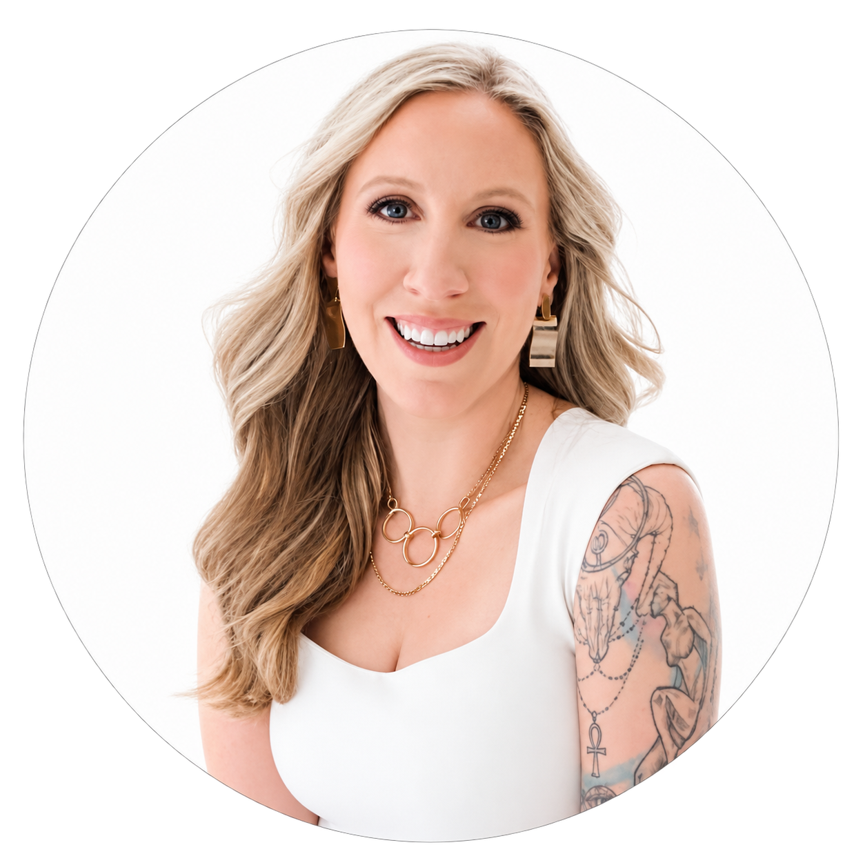 Megan, a smiling blonde woman in a white tank top with gold bar earrings and a gold ring necklace, a large tattoo across her upper arm