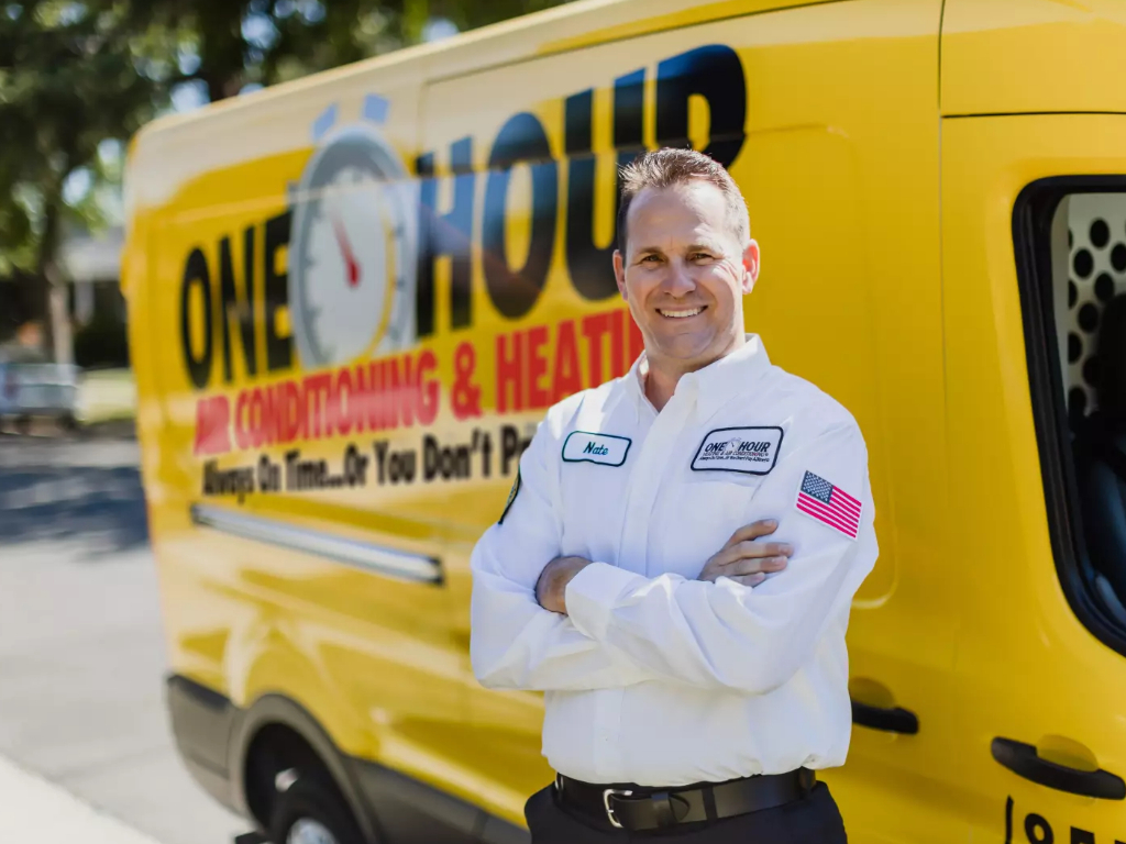 One Hour HVAC technician standing in front of service van North Atlanta