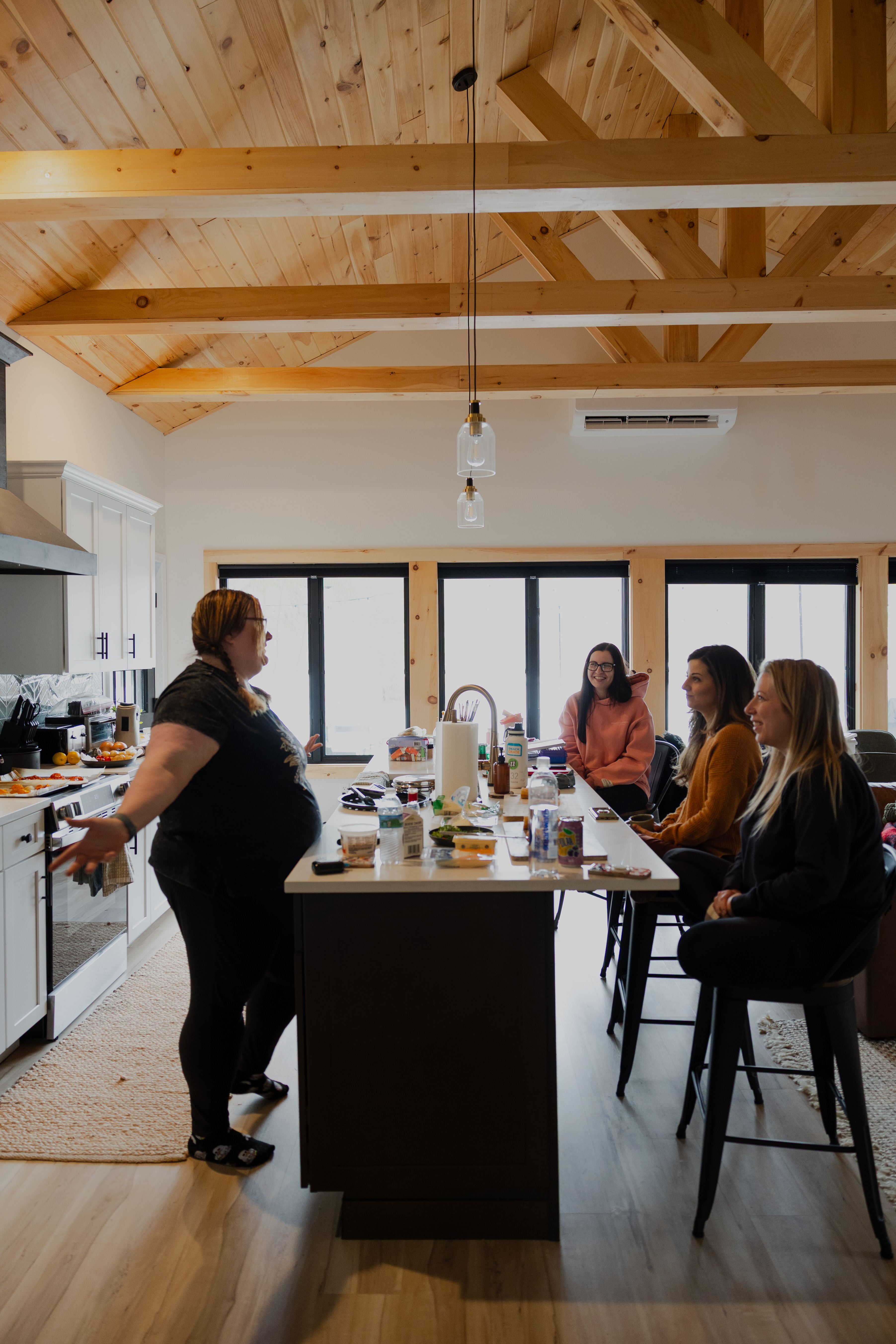 Women gathered in a kitchen space during a group retreat.  RETREAT-8346.jpg