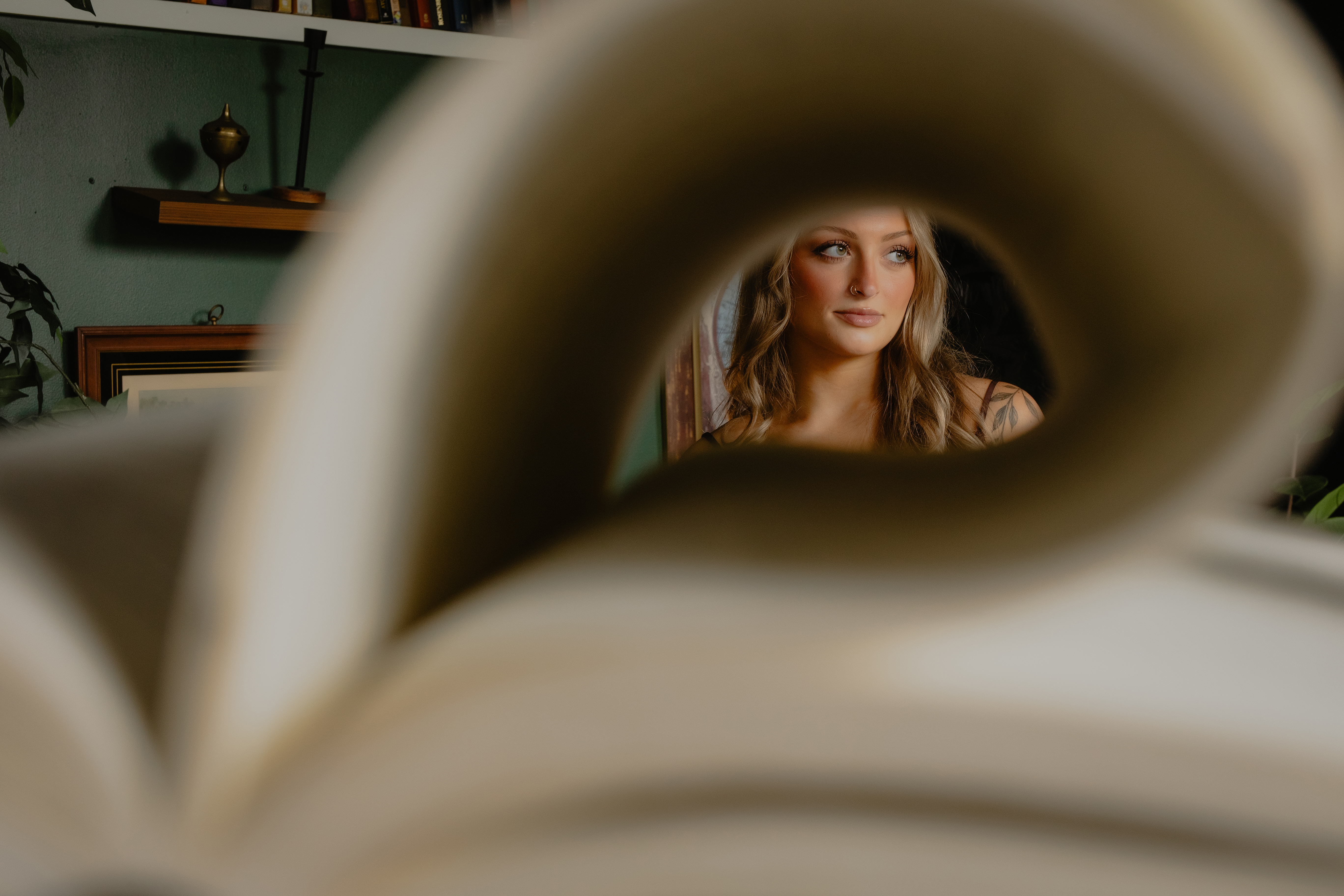 looking at a girl through a book 