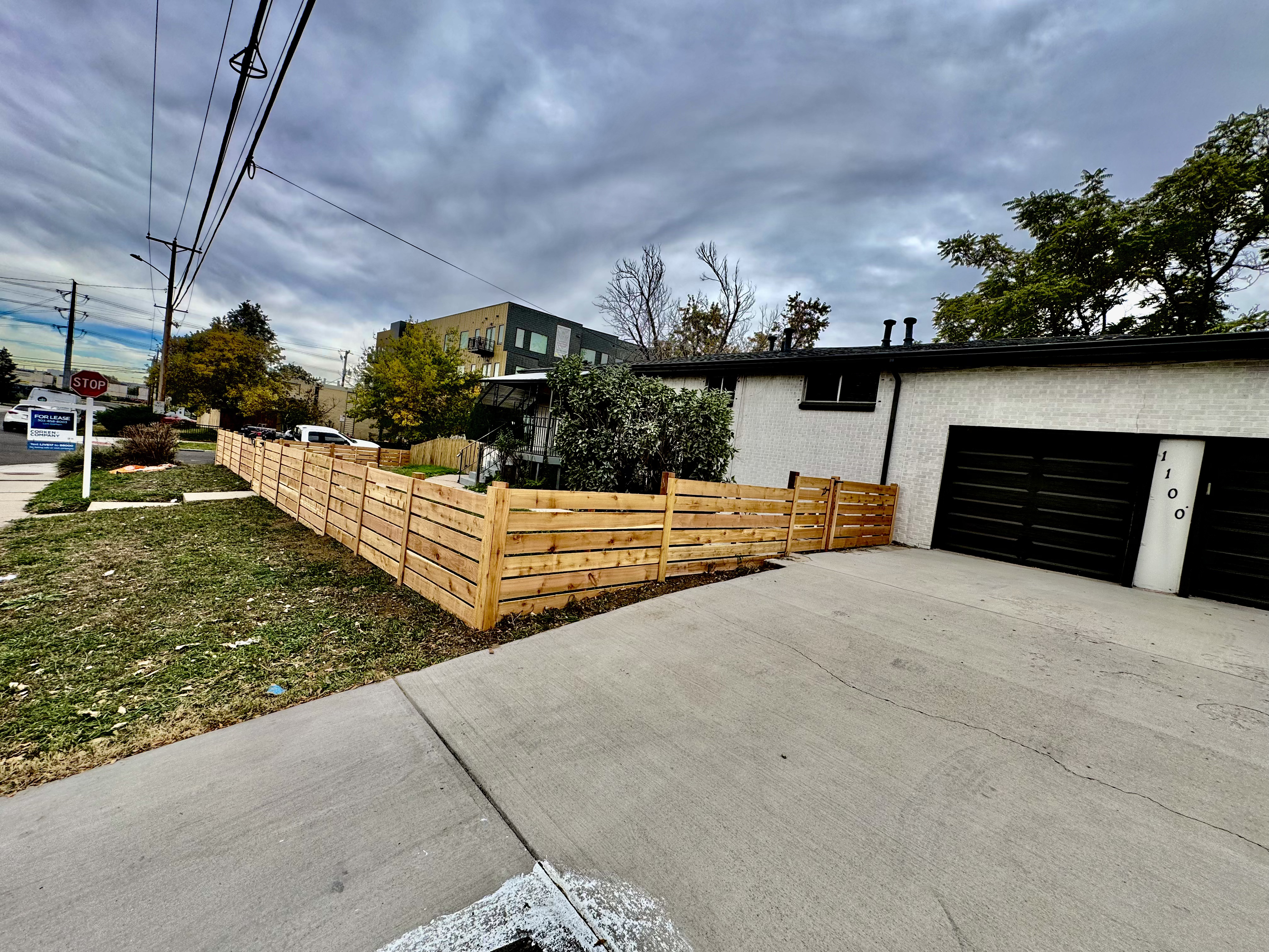Tall wood privacy fence enclosing a backyard patio in Thornton, CO
