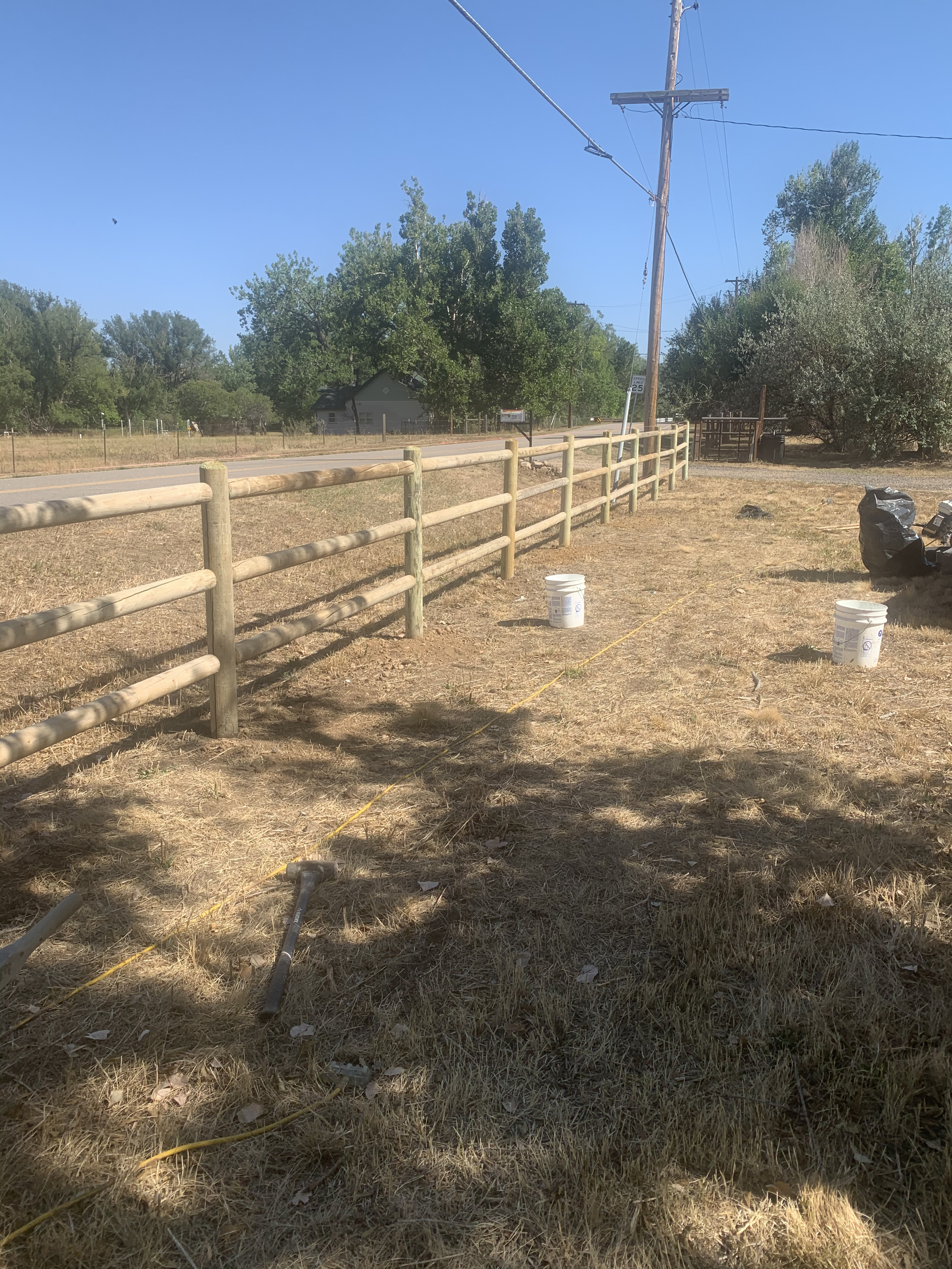 Ranch rail fence along a Thornton, CO property boundary