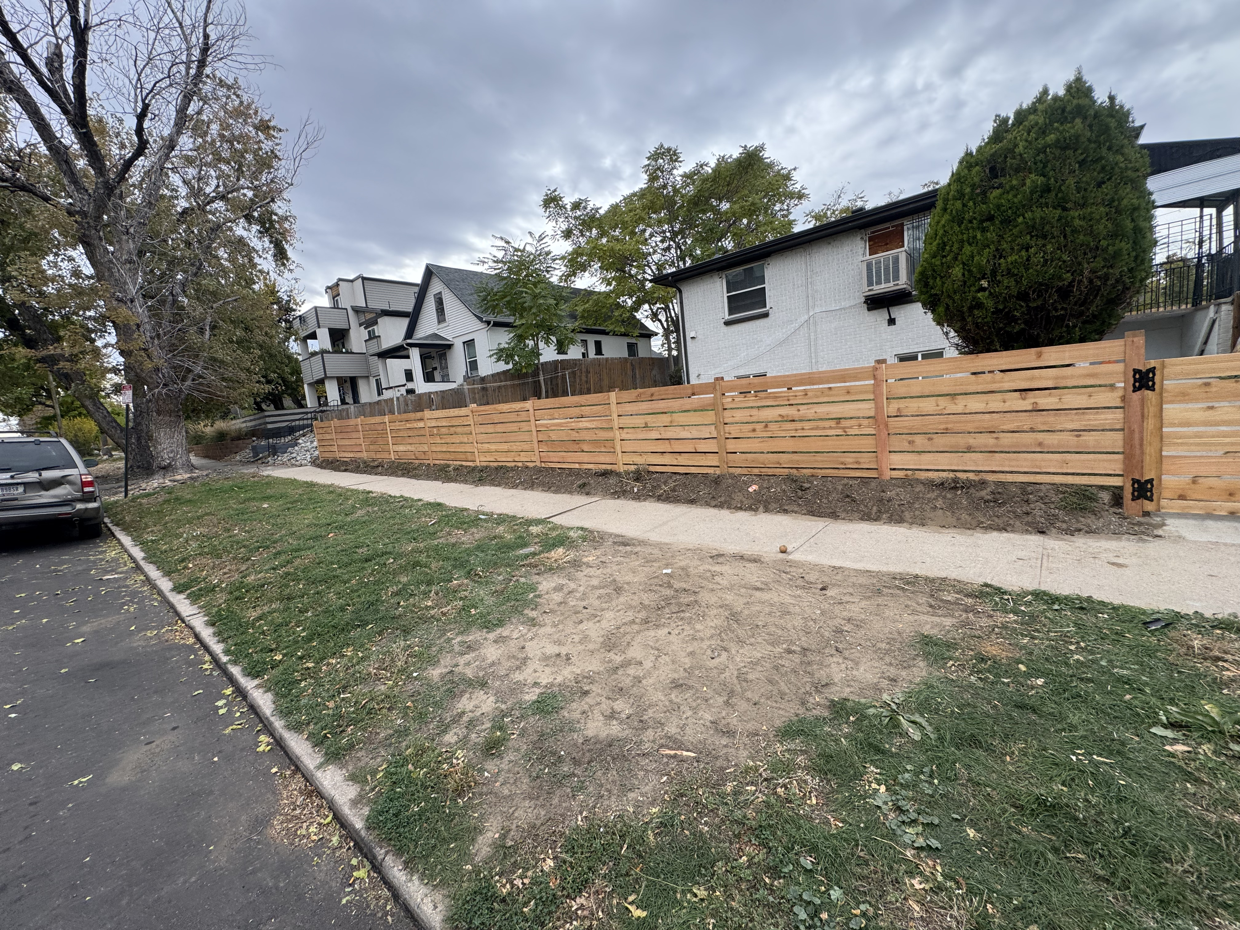 All About Fencing crew installing a fence in a Westminster, CO neighborhood