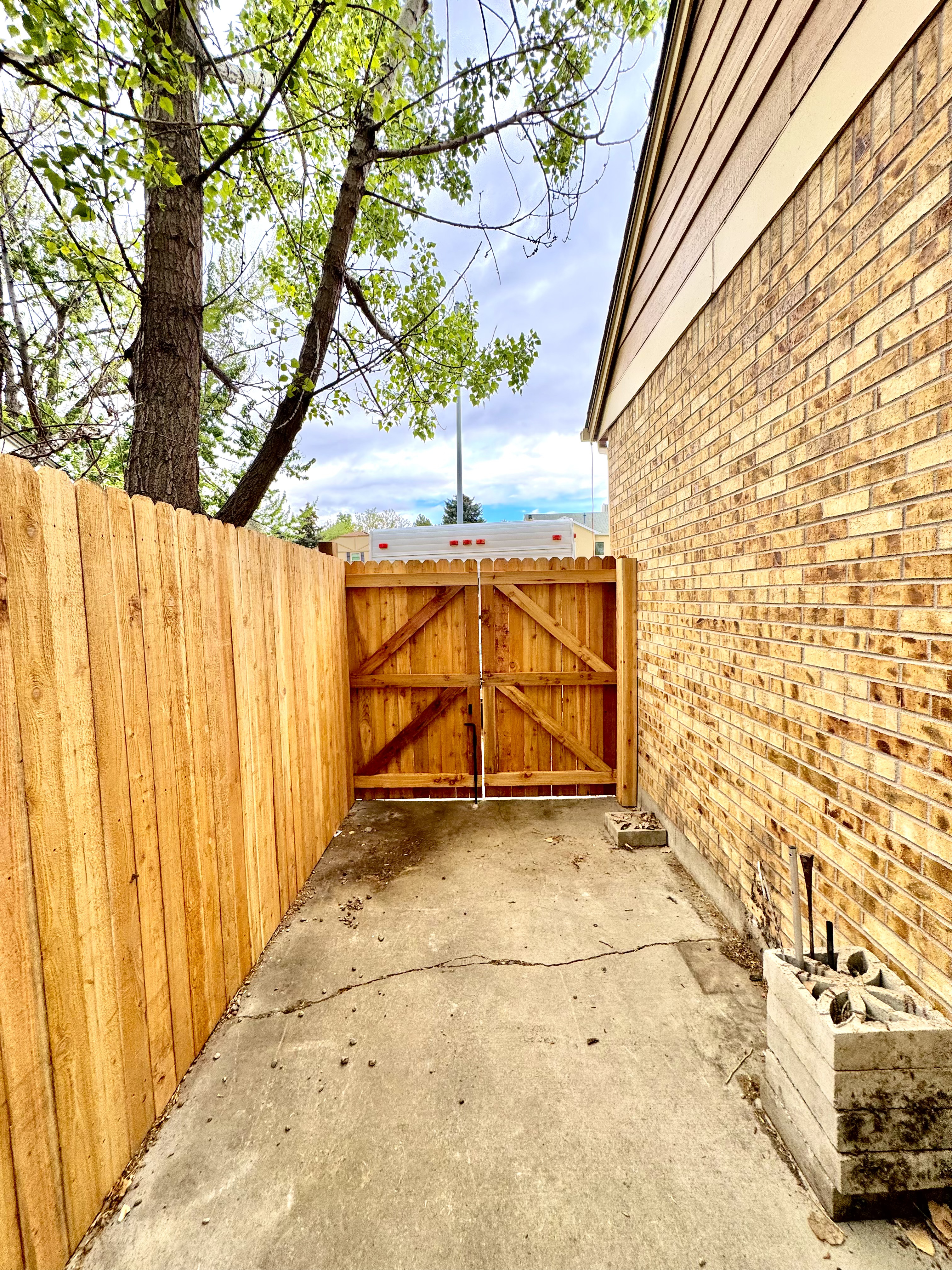 All About Fencing crew installing a fence in a Denver, CO neighborhood