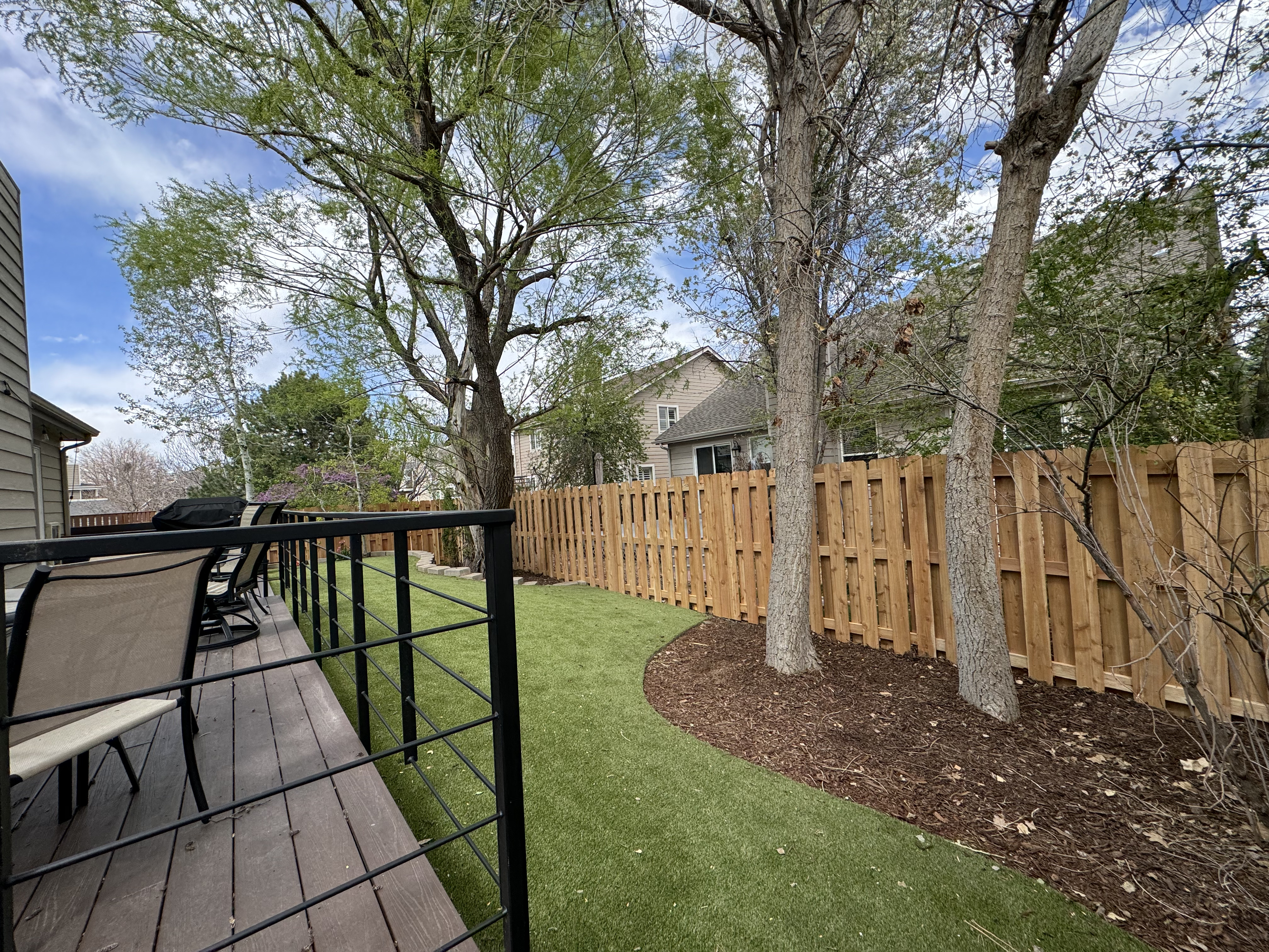 Finished wood privacy fence installed by All About Fencing with the Colorado foothills in the background, Thornton, CO