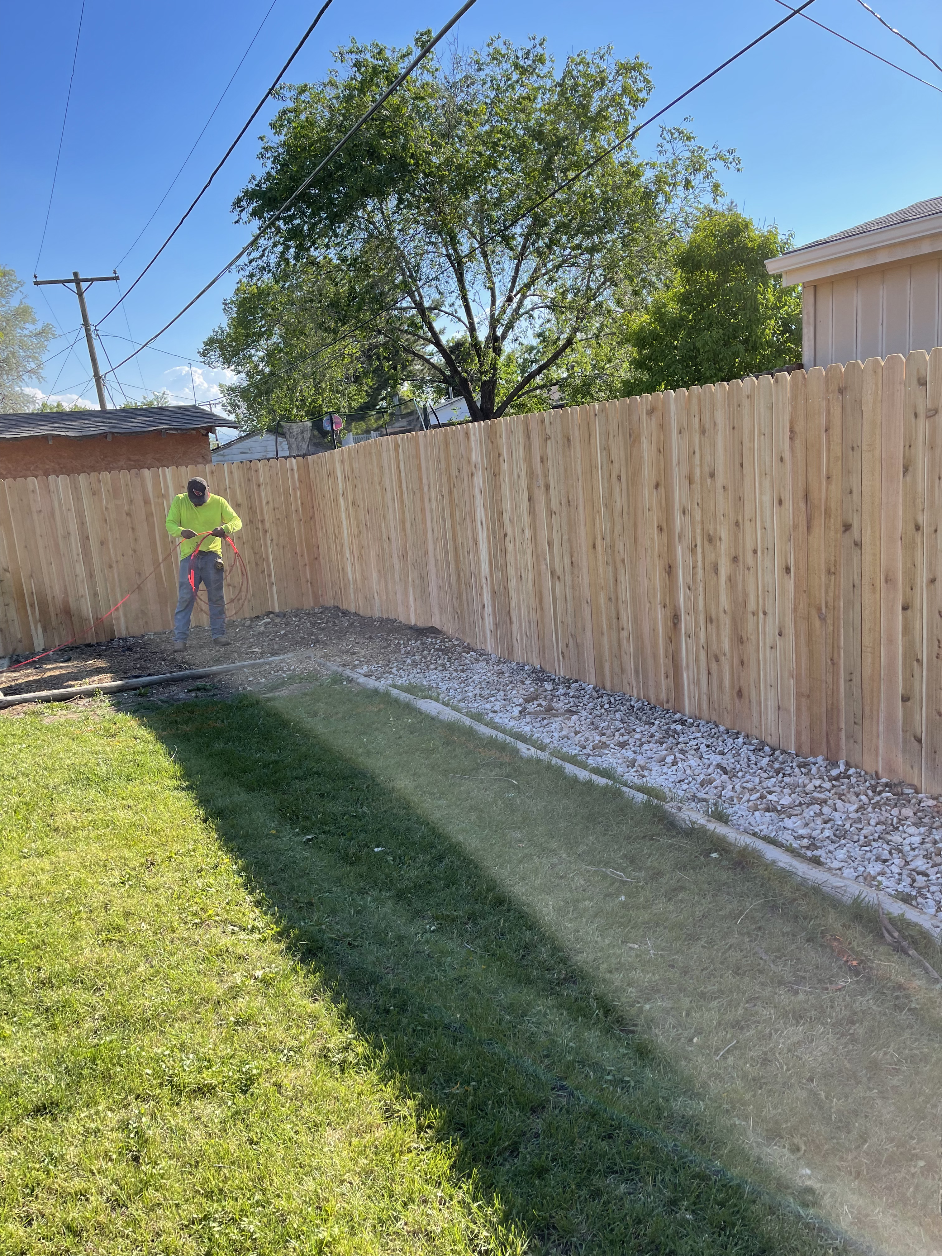 Leo and the All About Fencing crew installing a fence in Thornton, CO
