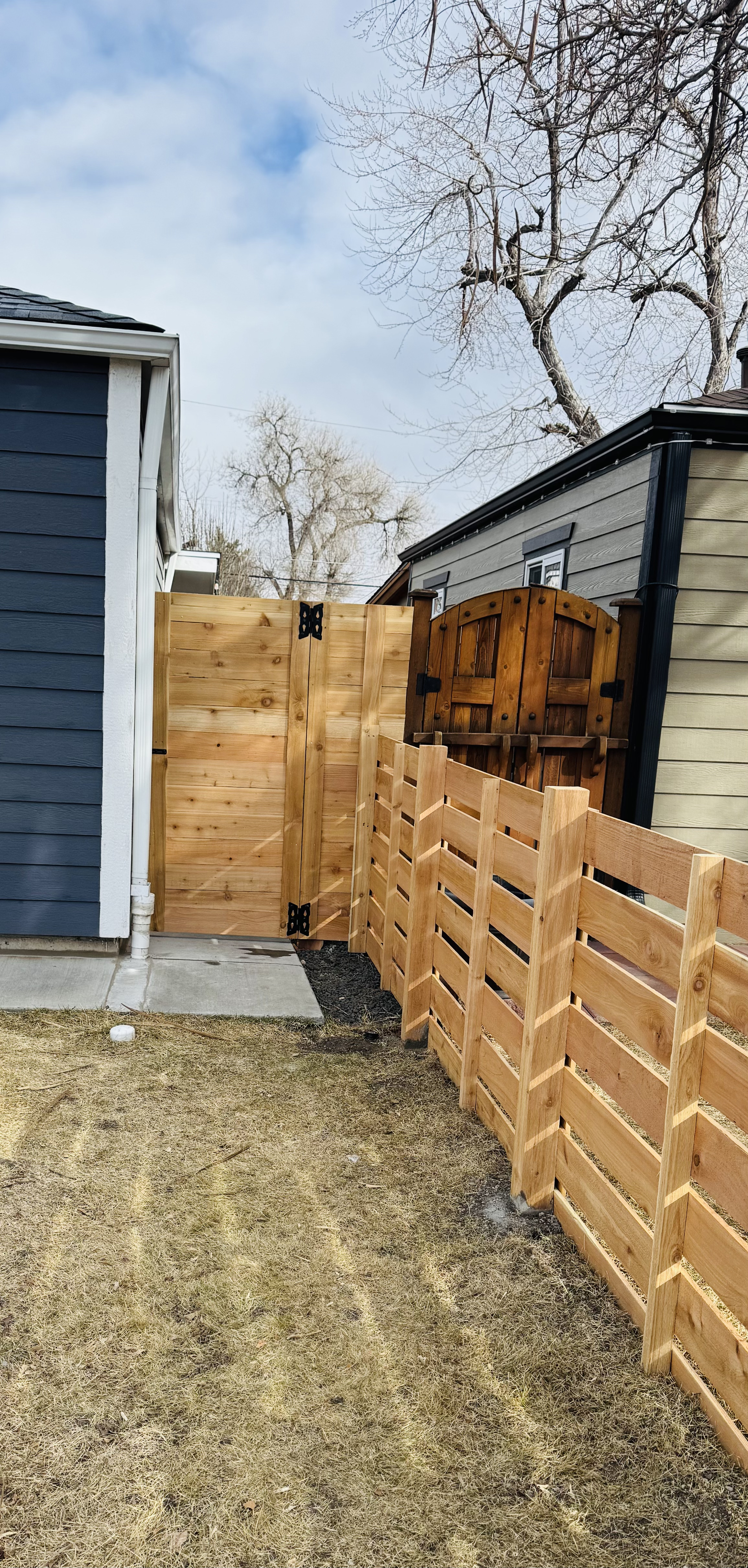 All About Fencing crew installing a fence in an Arvada, CO neighborhood