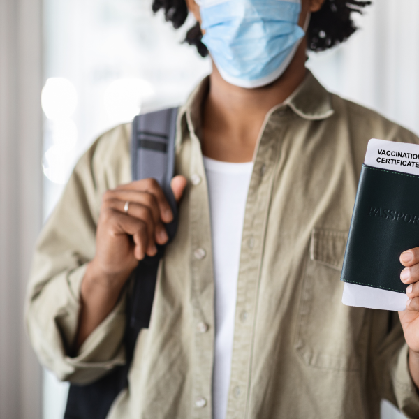 pandemic-travels-black-male-traveller-holding