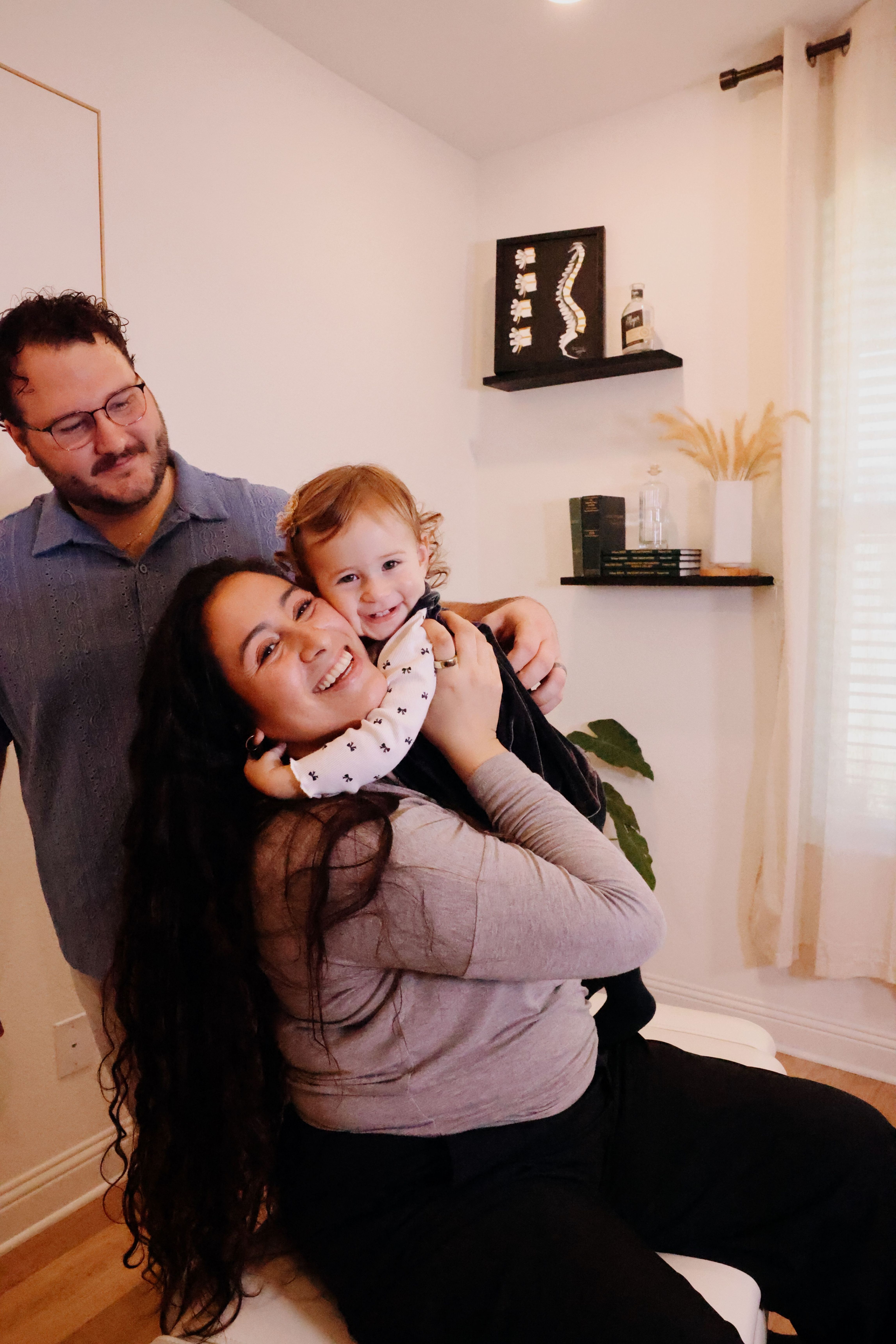 Dr. Justin, Havanna, and their daughter Brynlee at Ignite Chiropractic