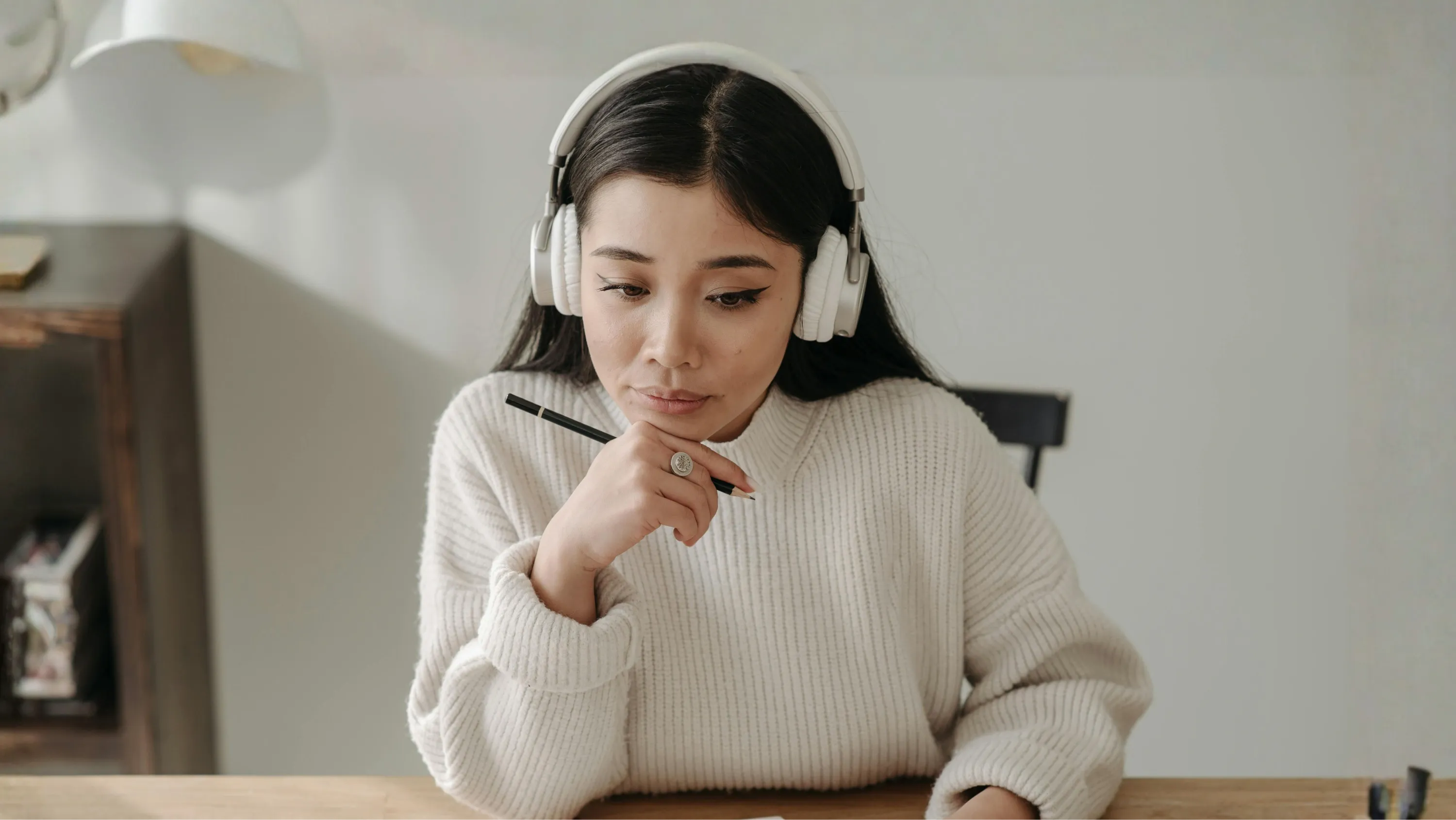 Woman enjoying feminine leadership podcast for soul-led entrepreneurs by Jessica Read