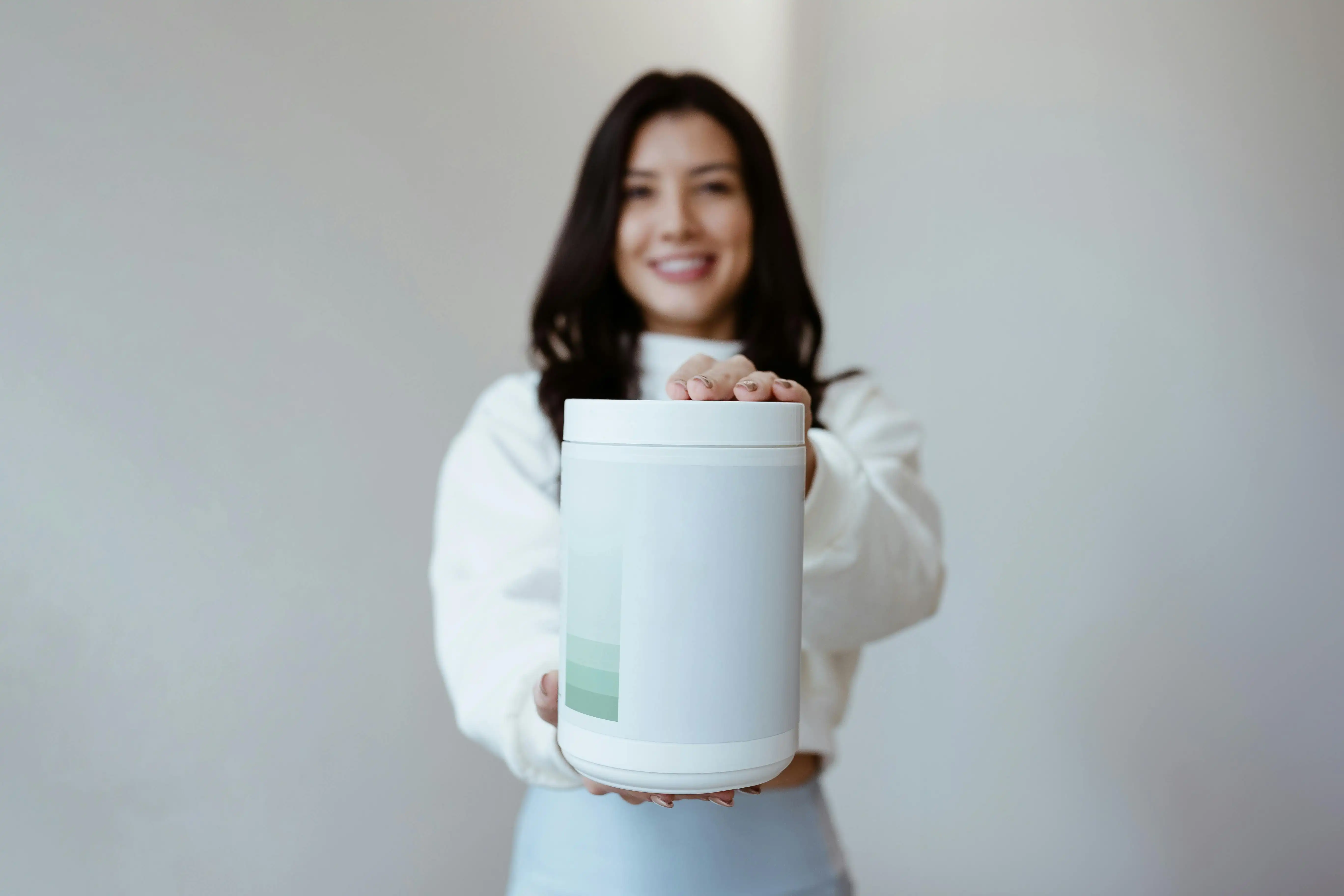 Woman business owner presenting her offer with confidence and joy, embodying the identity shift that allows female founders to sell without apology after a free live session