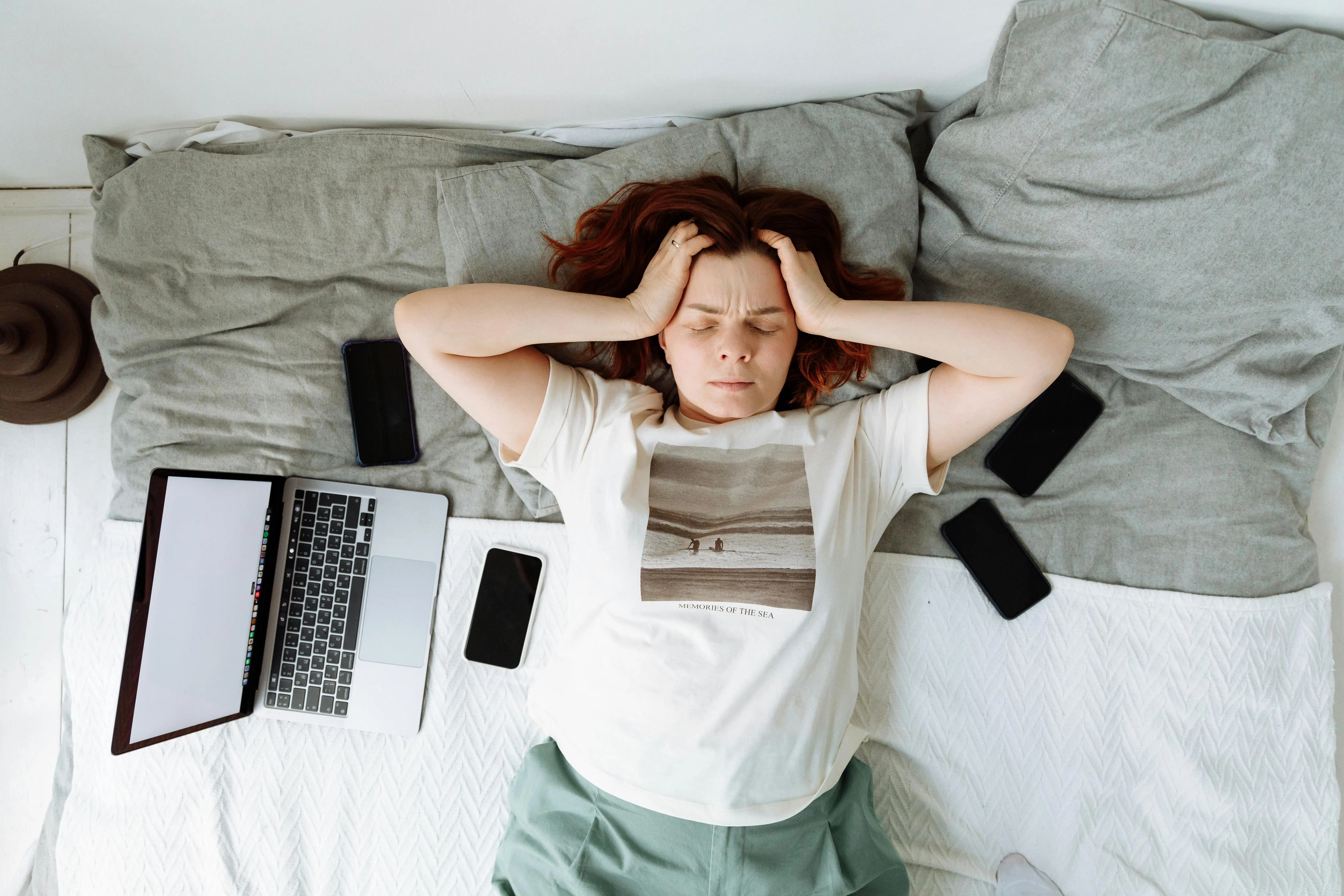 Female founder at laptop looking exhausted from cold outreach lead generation strategy that isn't converting