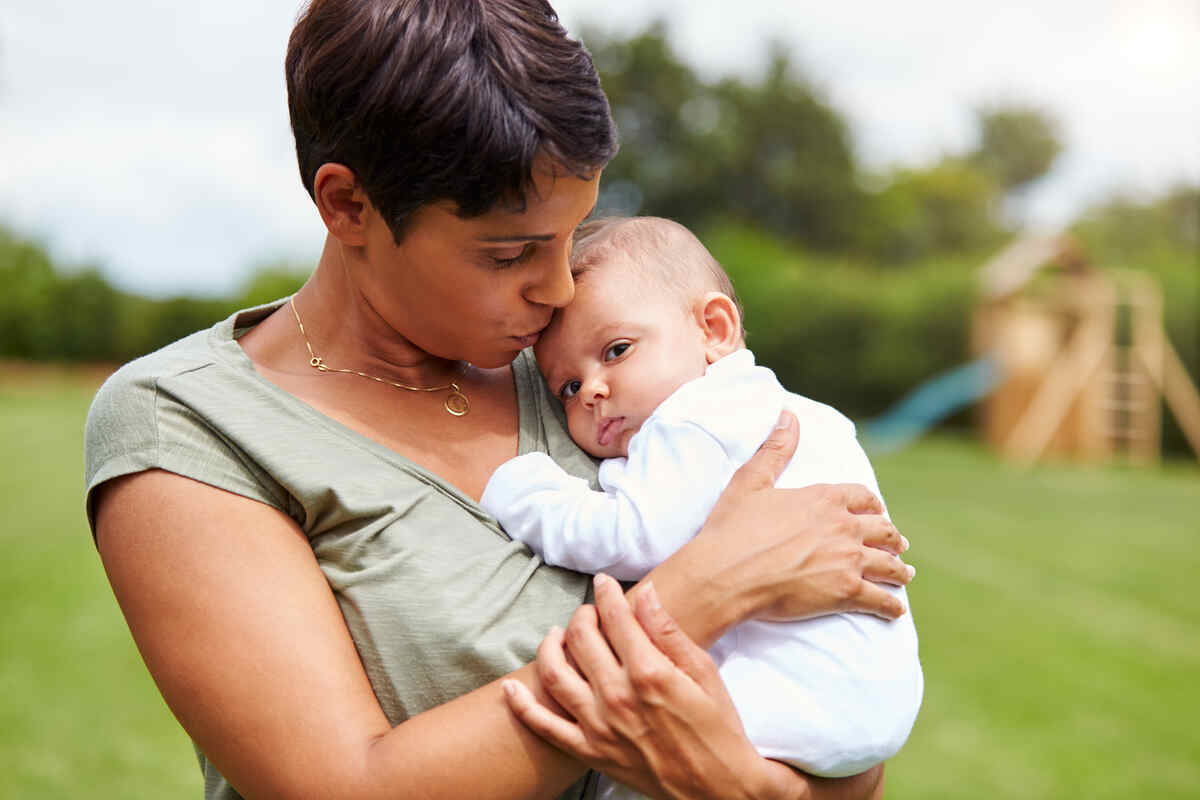 Infant attachment and brain development supported by nurturing touch and emotional connection