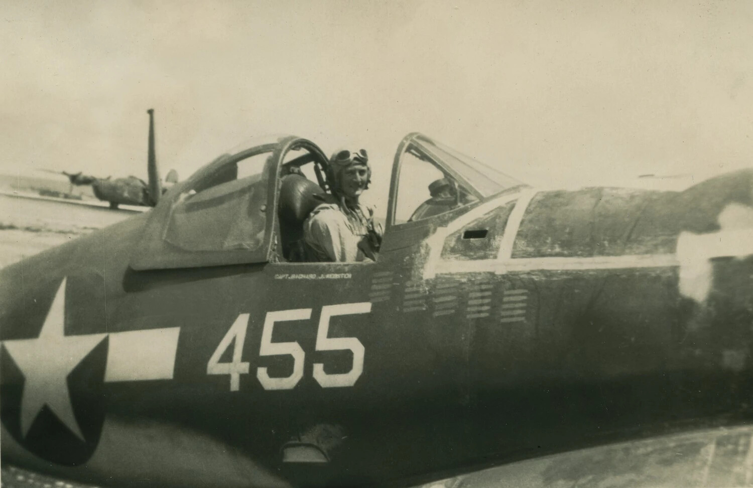 Pilot in Cockpit of Fighter Aircraft "455" with Mission Tally Marks, WWII Pacific Theater