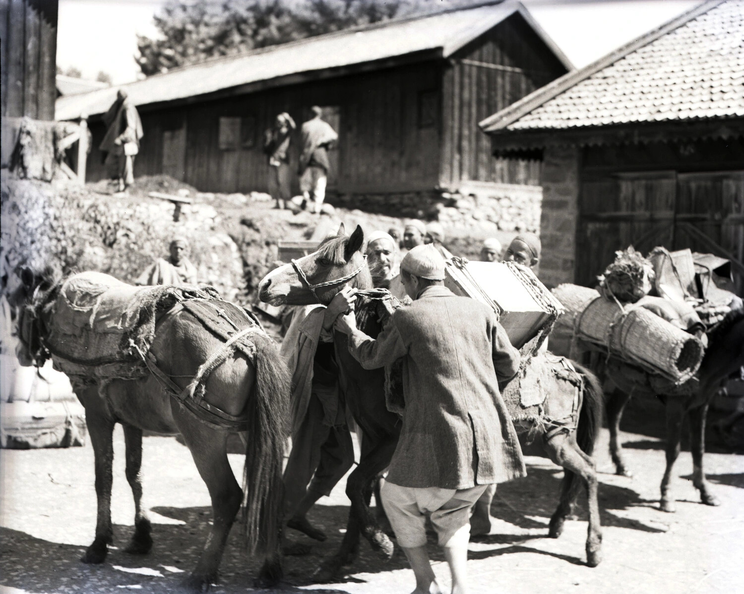 Villagers Loading Pack Horses in a Kashmir Village Street, WWII Era