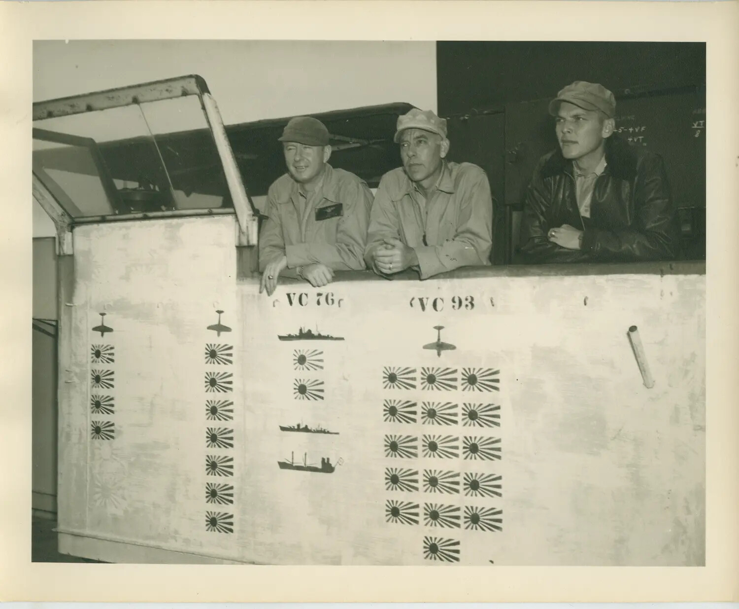Naval Aviators Pose with Squadron Victory Scoreboard, USS Petrof Bay (CVE-80), VC-76 and VC-93, WWII Pacific Theater