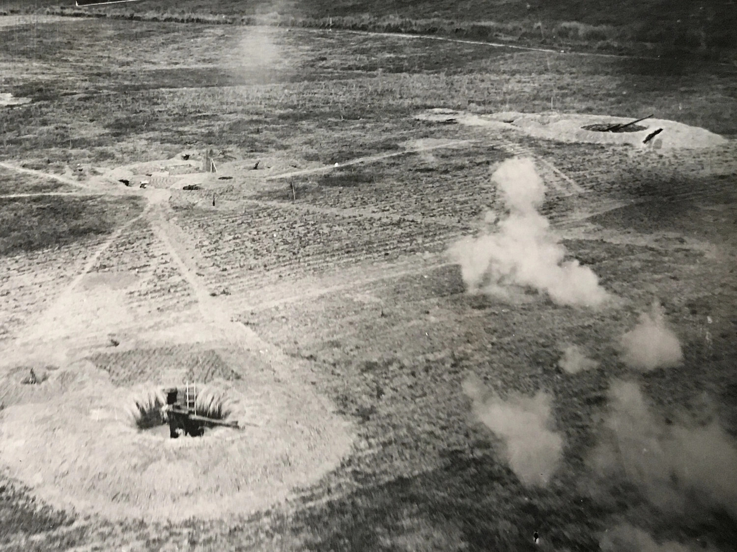 Aerial View of Japanese Anti-Aircraft Gun Emplacements Under Attack