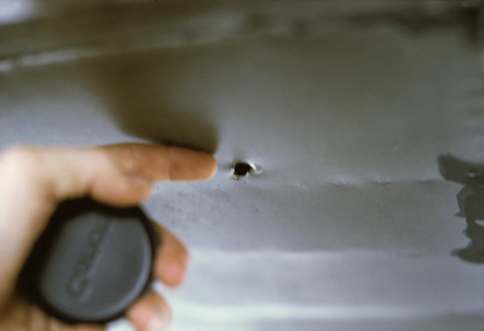 Close-Up of Combat Damage Puncture Hole on Aircraft Skin, Don Engebretsen Slide Collection