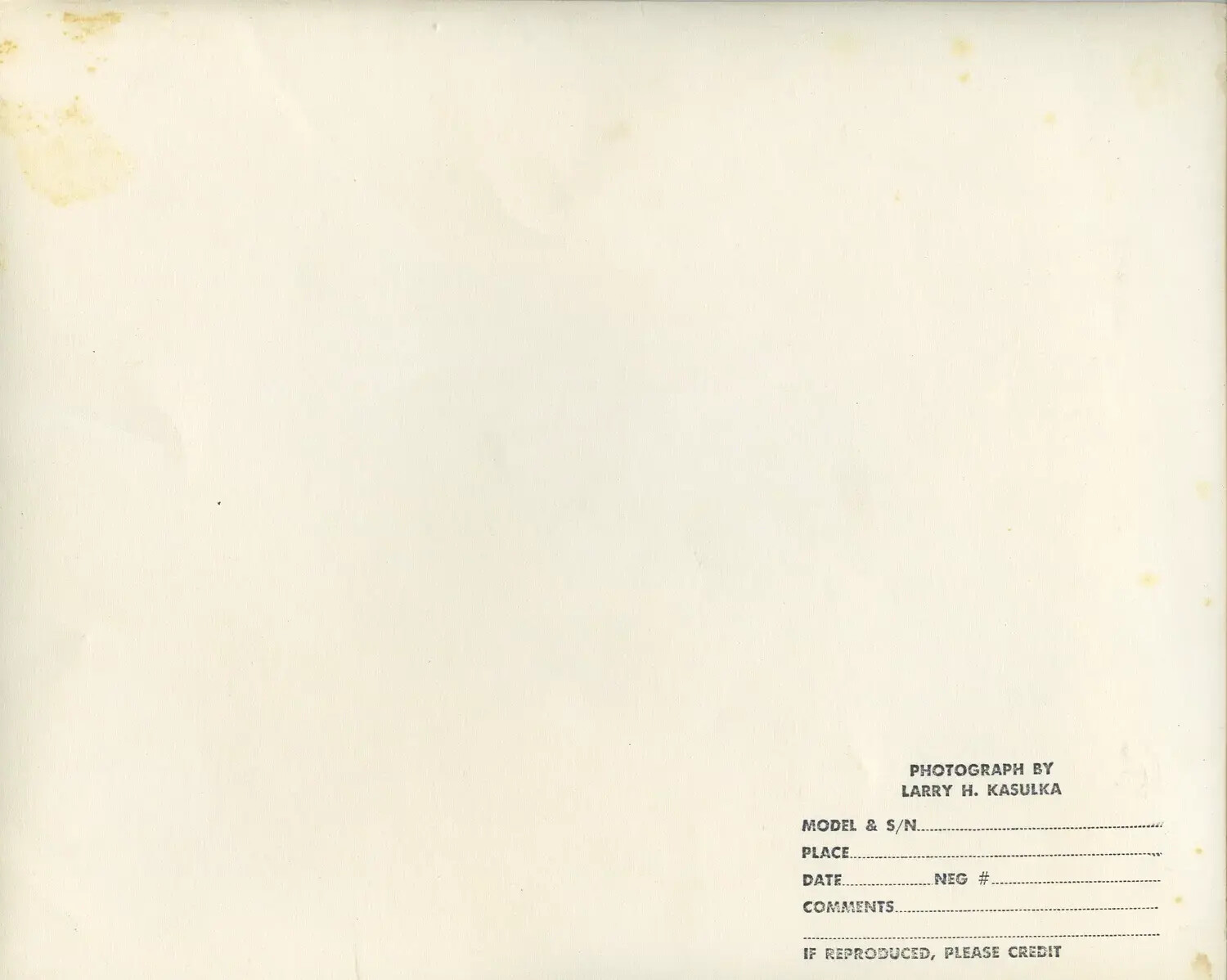 Verso of Photograph with Larry H. Kasulka Photographer's Credit Stamp