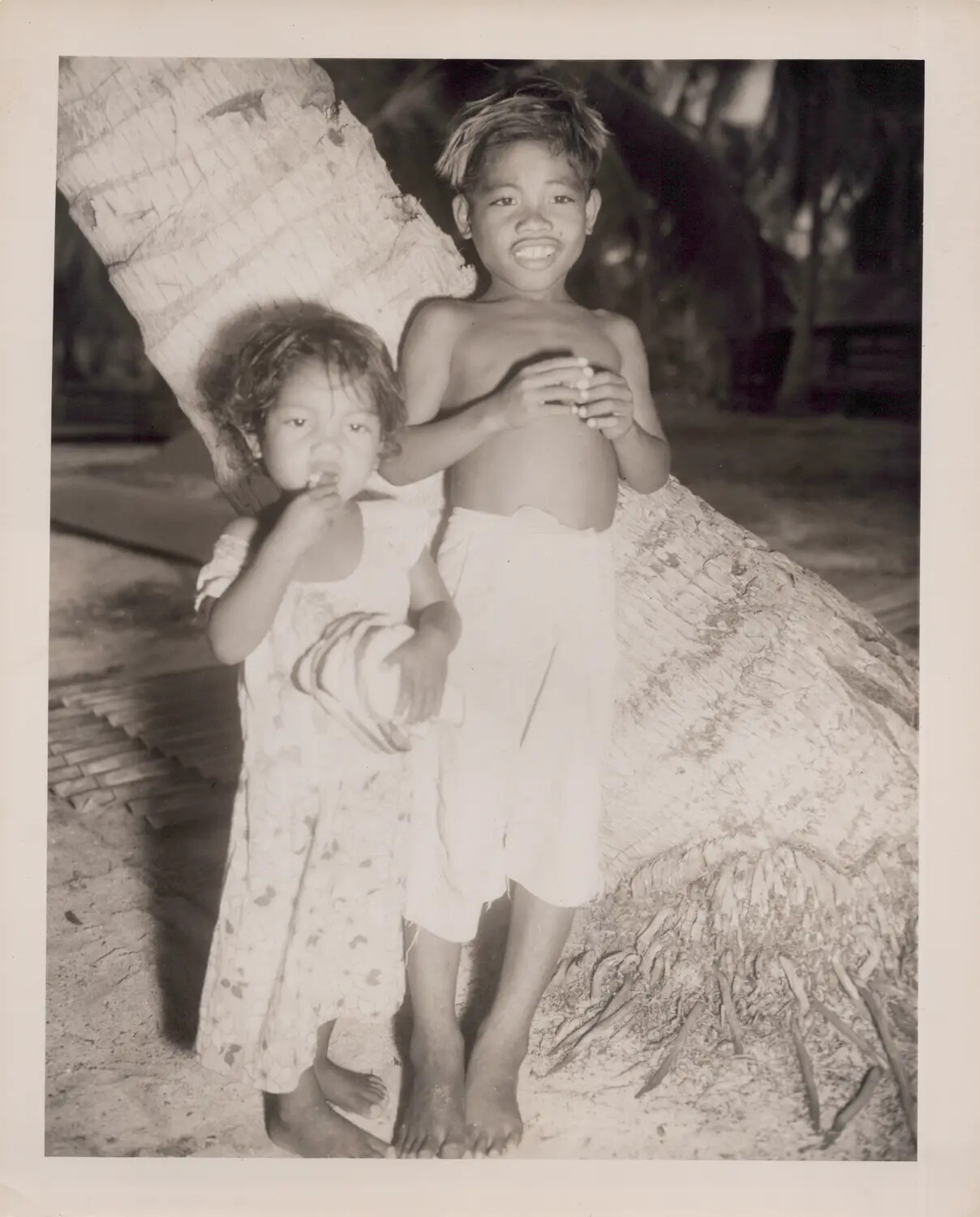 Pacific Islander Children Posed by Palm Trunk, World War II-Era Photograph