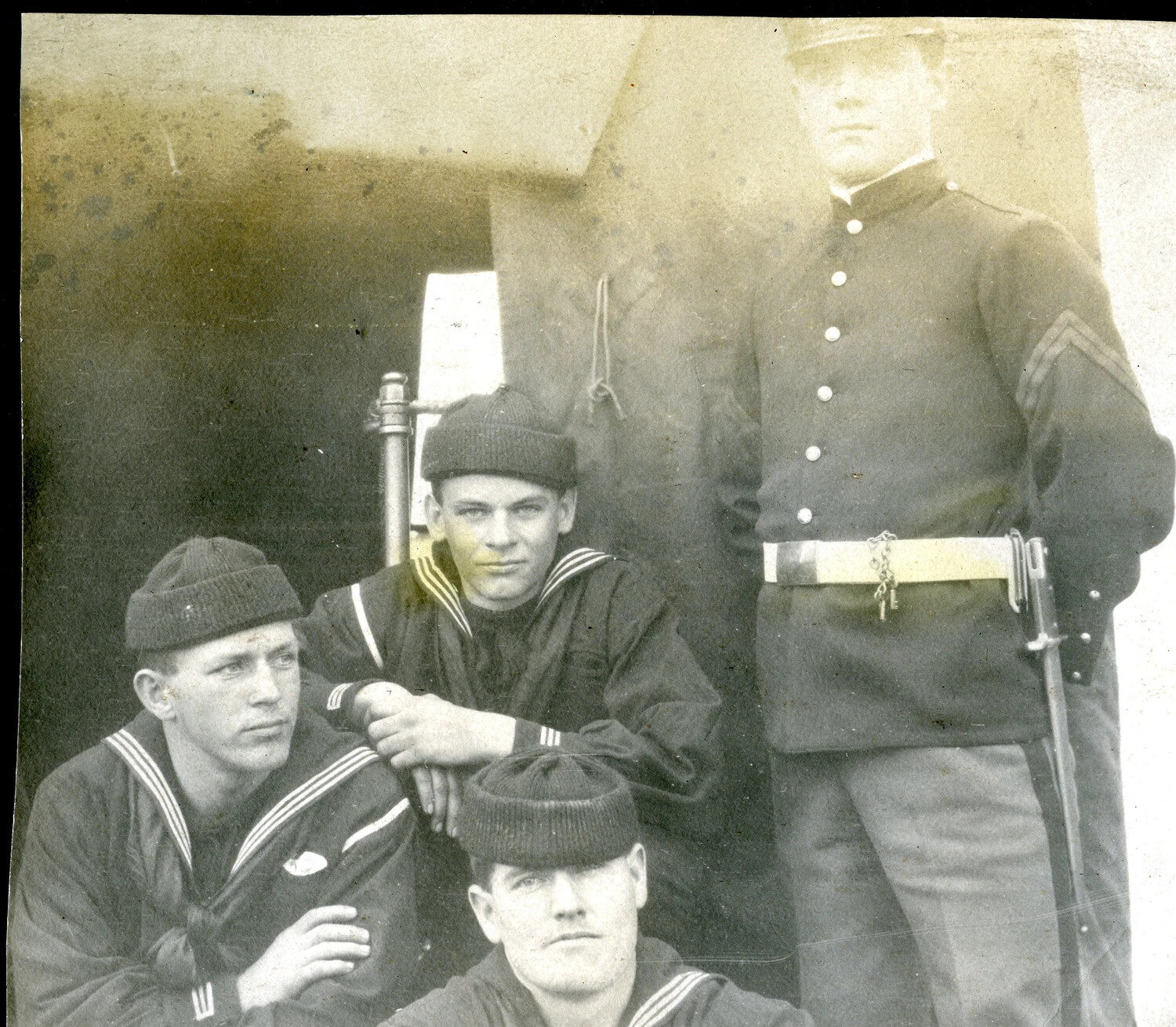 Ship's Petty Officer/Master-at-Arms with Three Bluejackets, Faded Group Portrait, c. 1900s