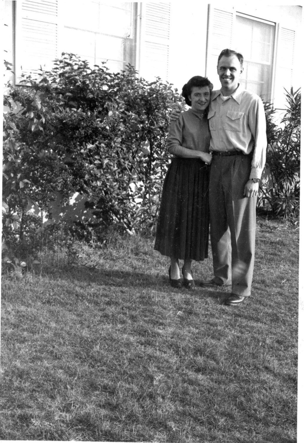 Couple Posing on a Residential Lawn, Bancroft Family Collection, Korean War Era