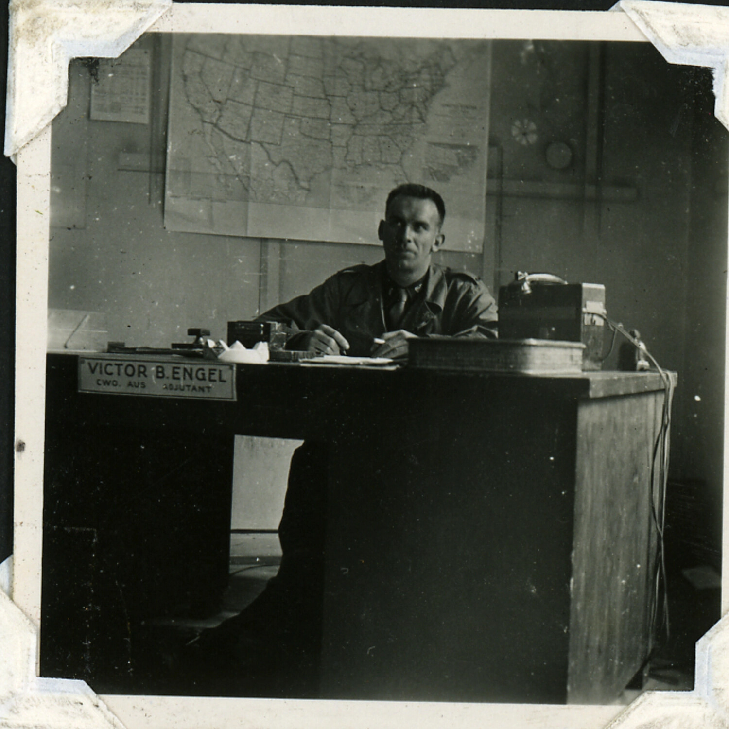 Chief Warrant Officer Victor B. Engel, Adjutant, at His Office Desk — WWII US Military in Australia Album
